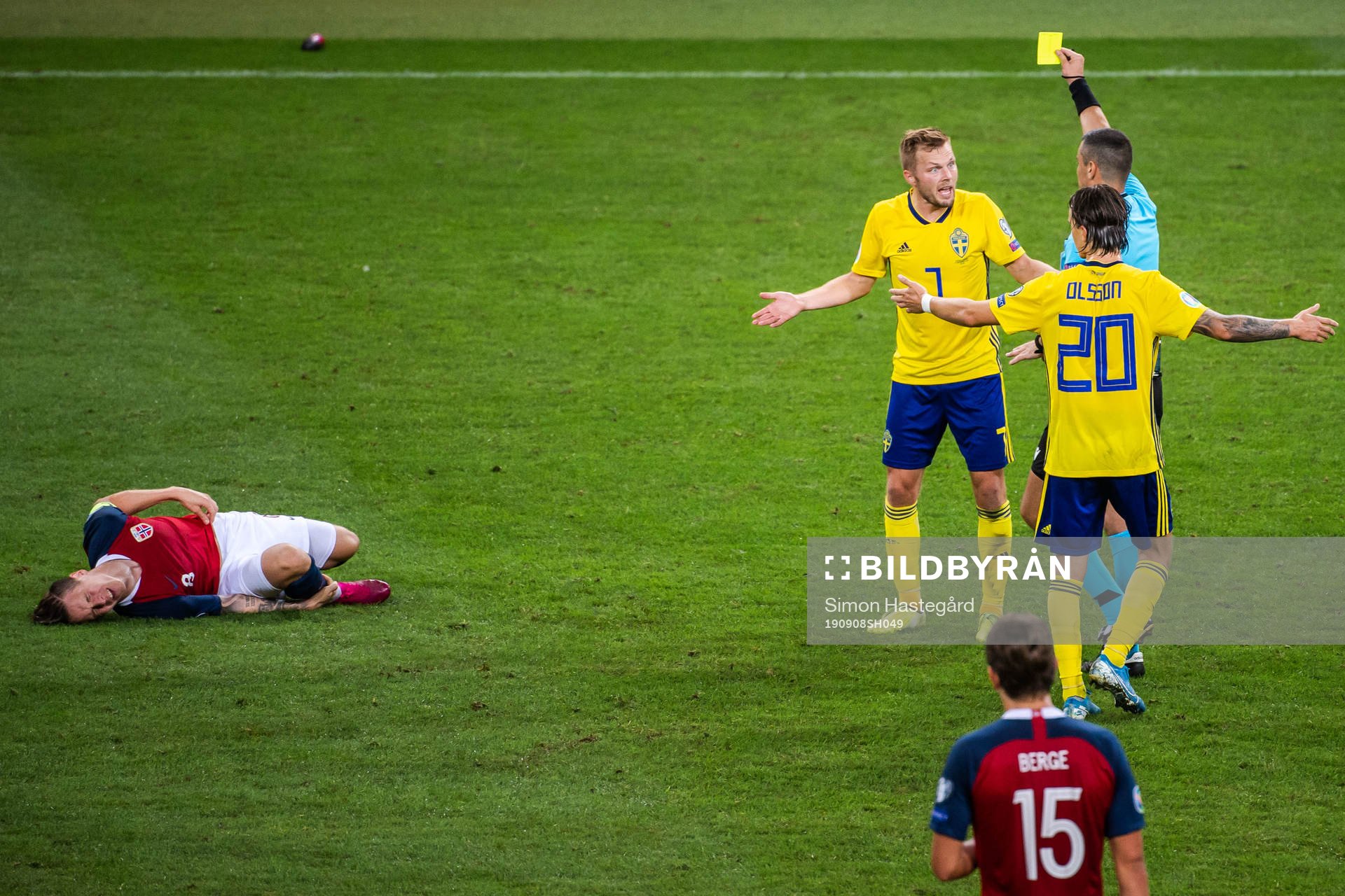 Sebastian Larsson of Sweden receives a varning from referee