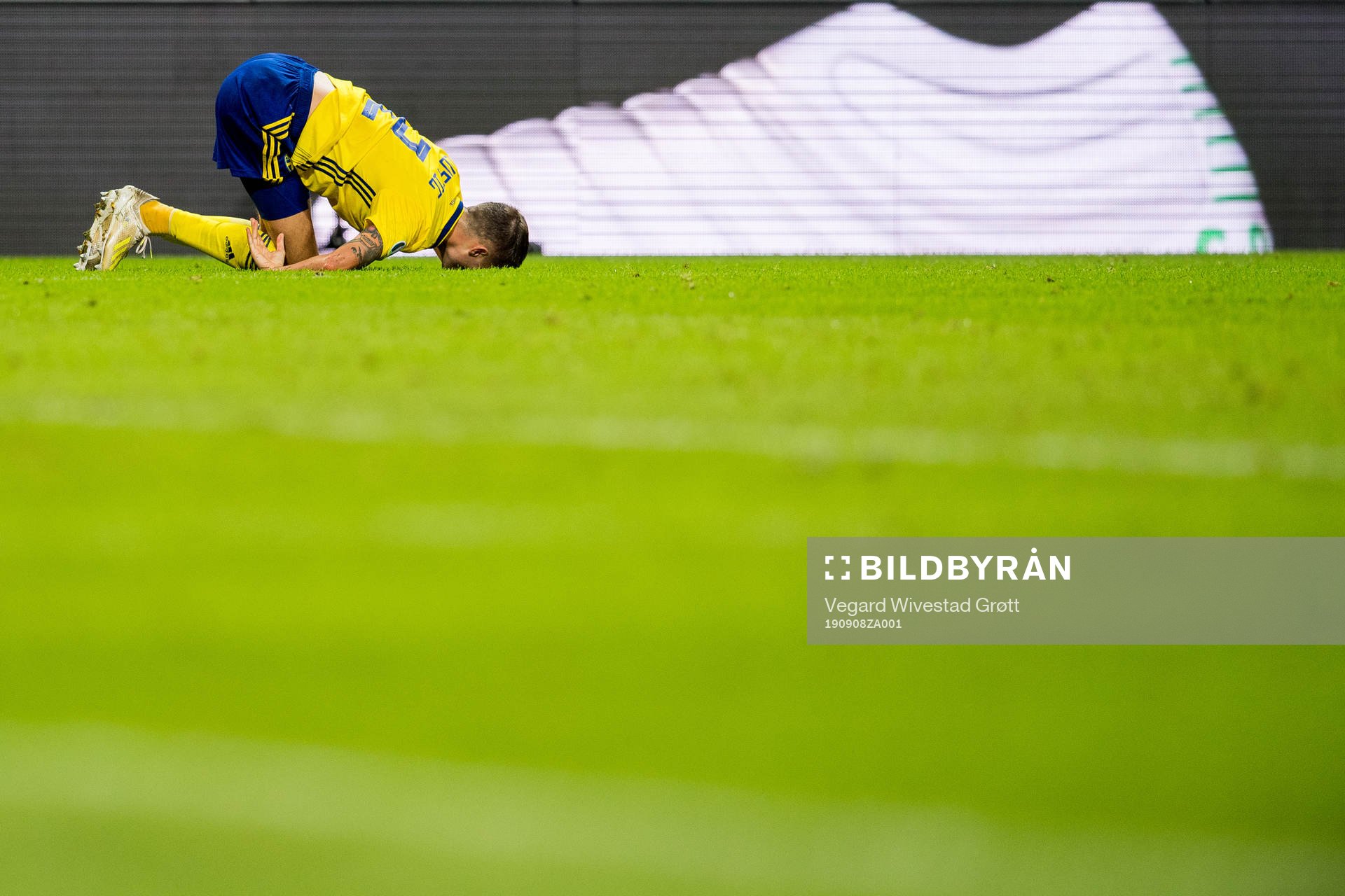 Mikael Lustig of Sweden lies down with an injury