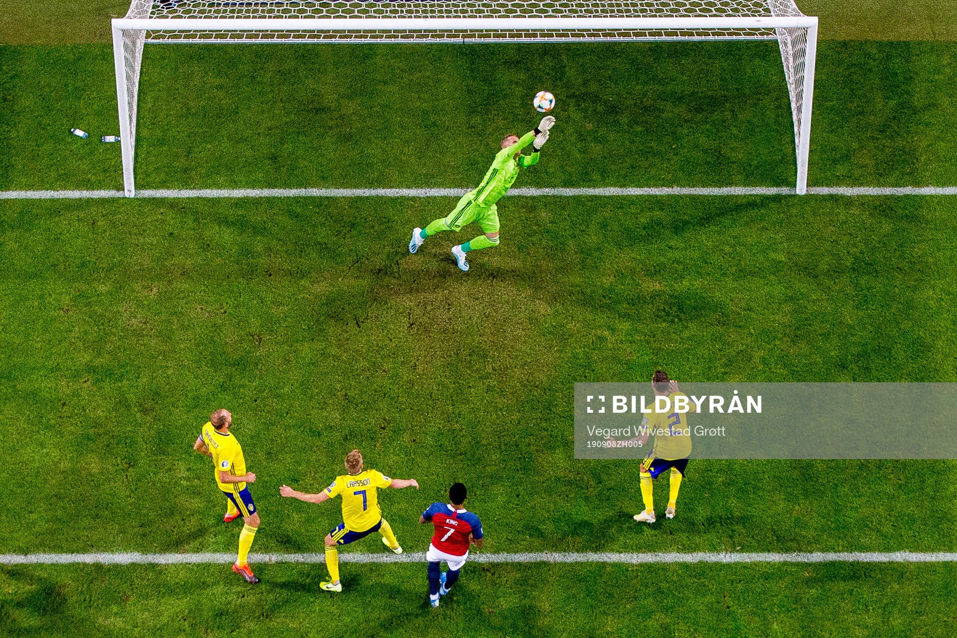 Goalkeeper Robin Olsen of Sweden saves the attempt from