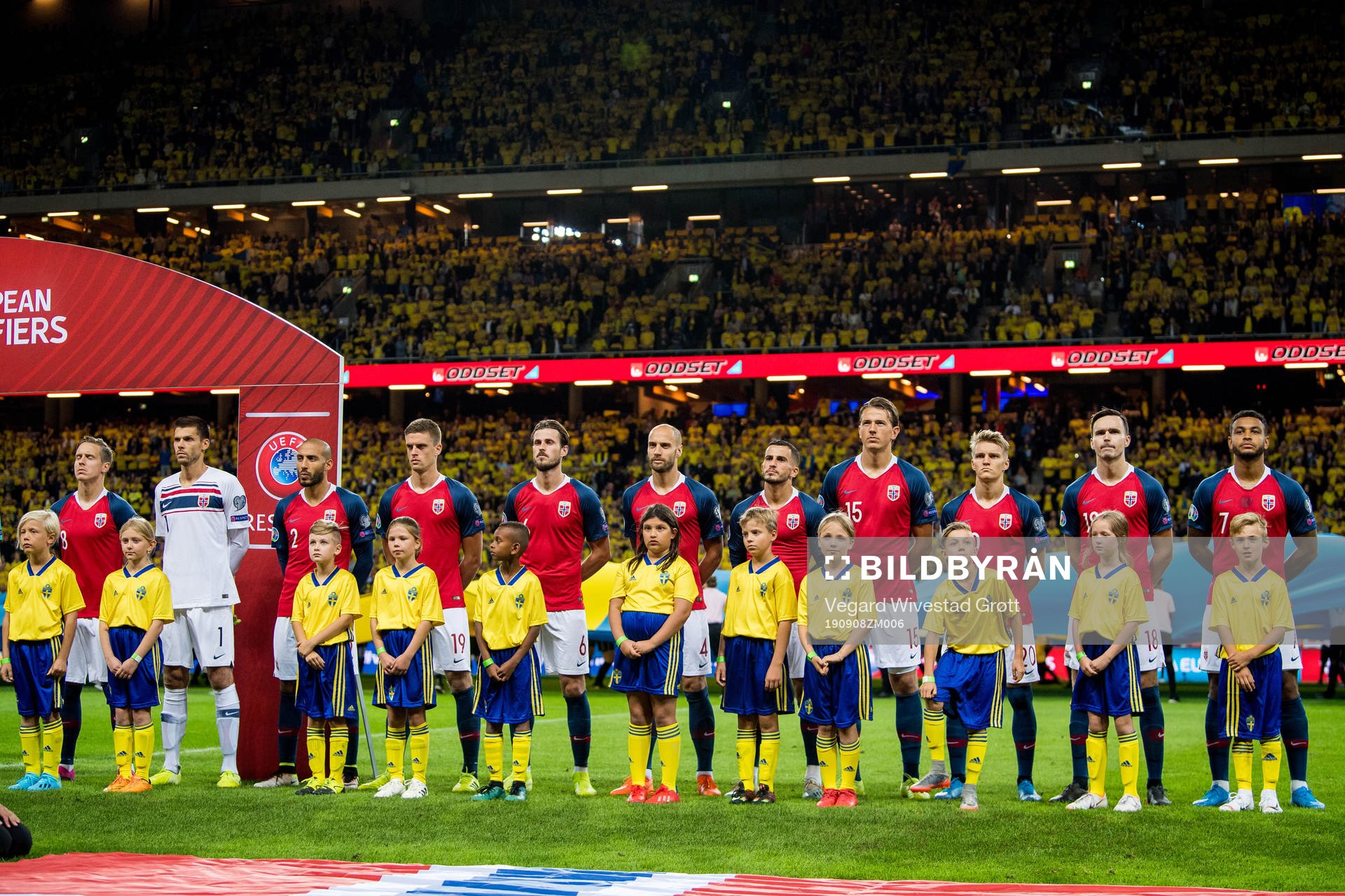 Stefan Johansen, goalkeeper Rune Almenning Jarstein, Haitam Aleesami, Markus Henriksen, Håvard Nordtveit, Tore Reginiussen, Omar Elabdellaoui, Sander Berge, Martin Ødegaard, Ole Kristian Selnæs and Joshua King of Norway are accompanied by children during line up ahead of the UEFA Euro Qualifier football match between Sweden and Norway on September 8, 2019 in Stockholm.