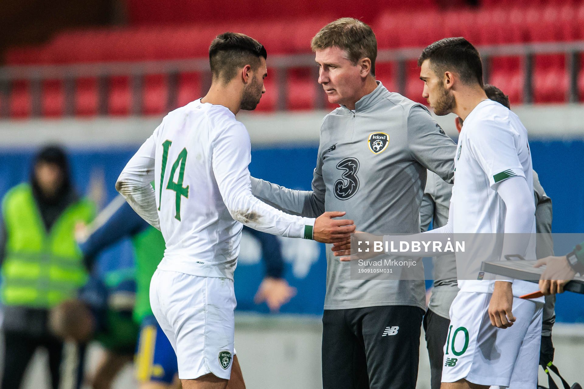 Daniel Mandroiu changes with Troy Parrott of Ireland
