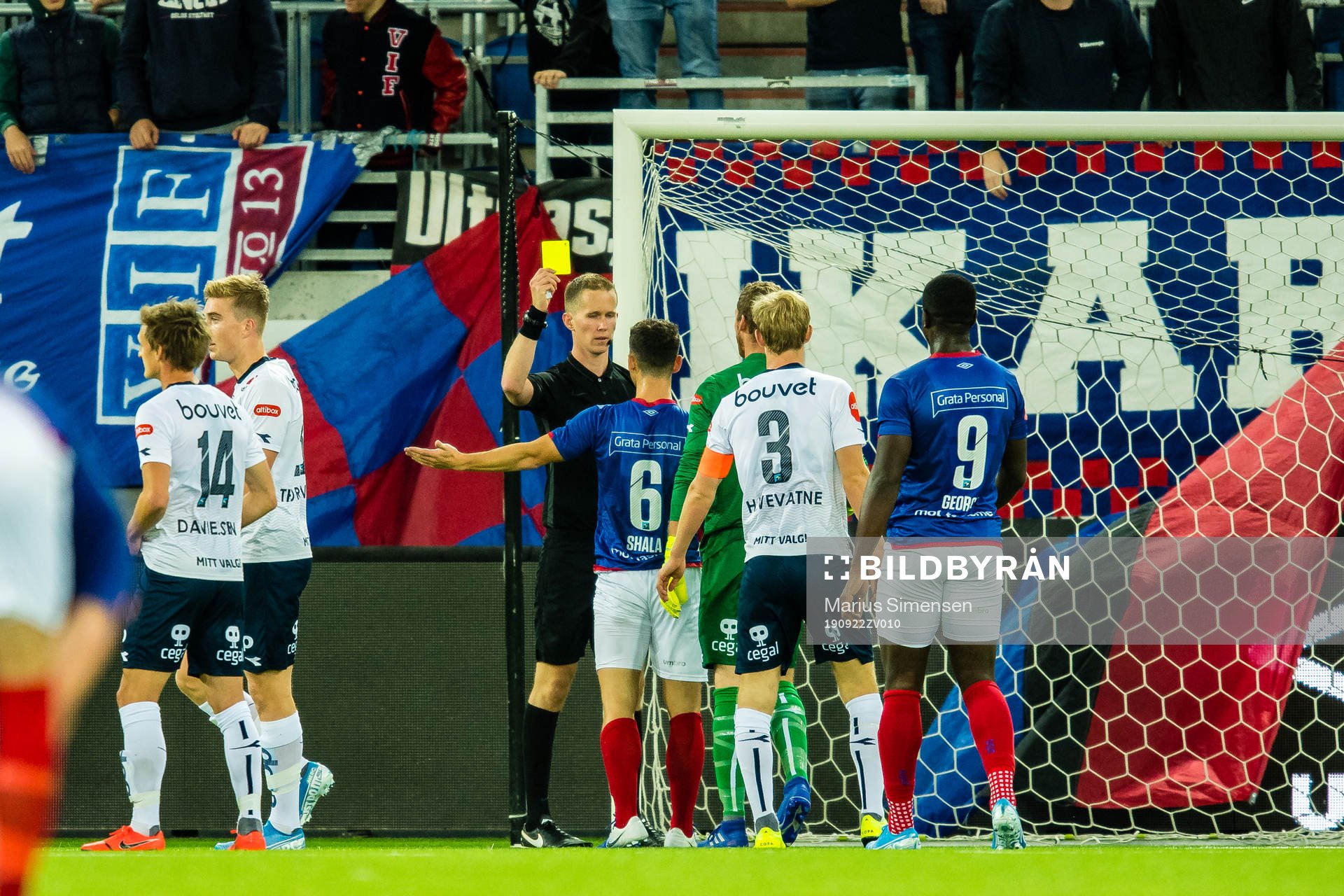 Herolind Shala of Vålerenga gets a yellow card by