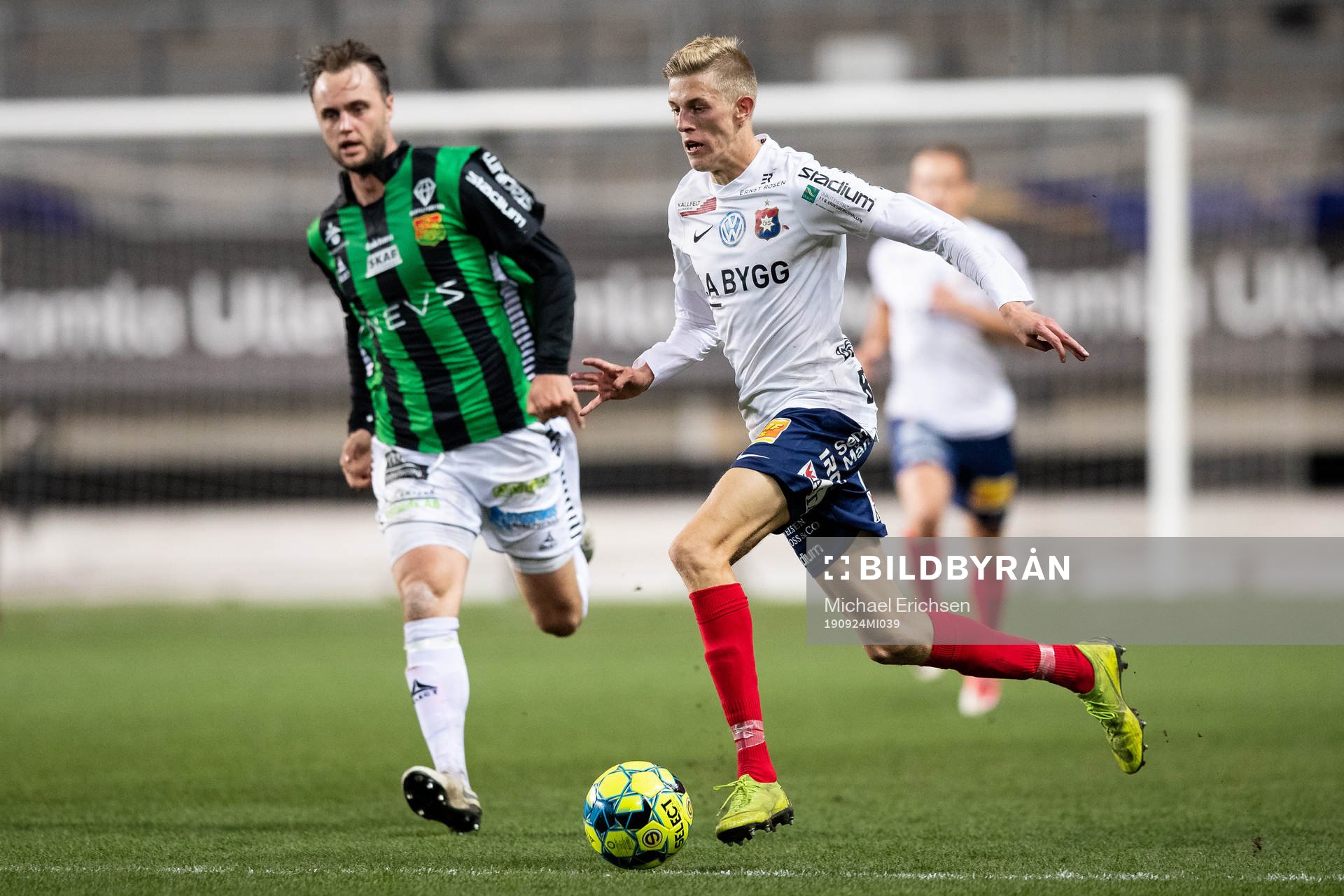 Örgrytes Alexander Bernhardsson före GAIS Niklas Olsson under fotbollsmatchen i Superettan mellan GAIS och Örgryte den 24 september 2019 i Göteborg.