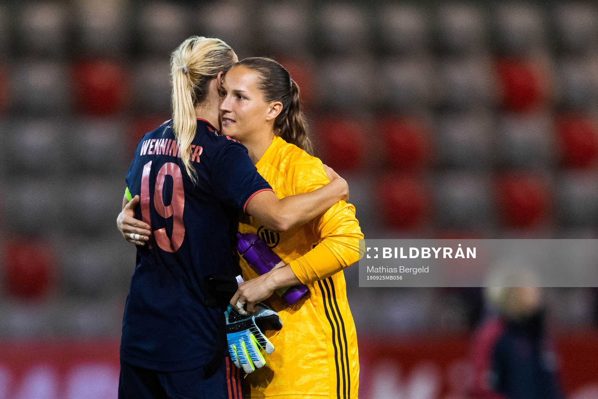 Carina Wenninger and goalkeeper Laura Benkarth of Bayern Munich celebrate after the second round of 32 Champions League match between Bayern Munich and Kopparbergs/Göteborg on September 25, 2019 in Munich.