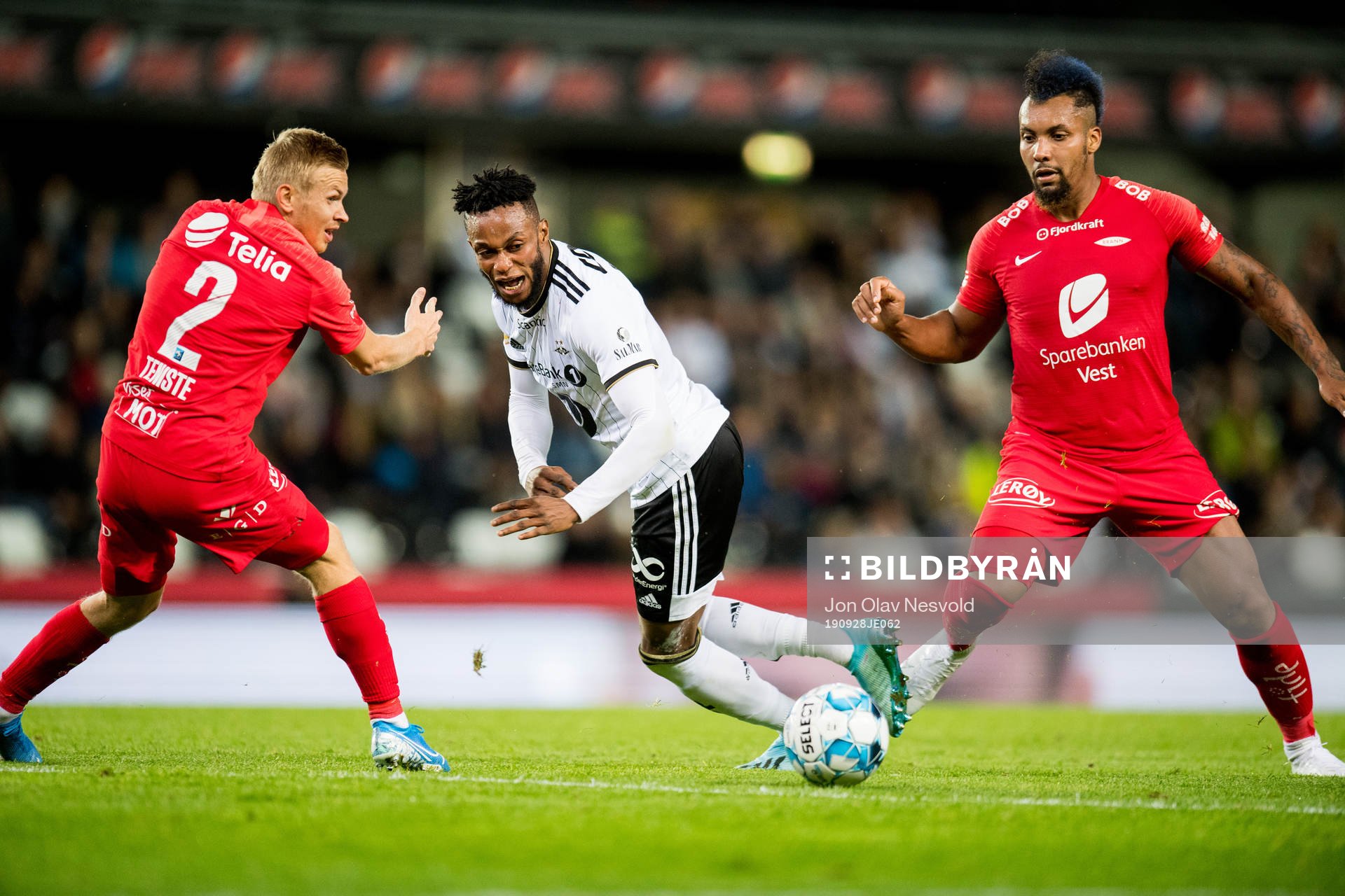 Taijo Teniste of Brann, Samuel Adegbenro of Rosenborg and Bismar Acosta of Brann during the Eliteserien match between Rosenborg and Brann on September 28, 2019 in Trondheim.