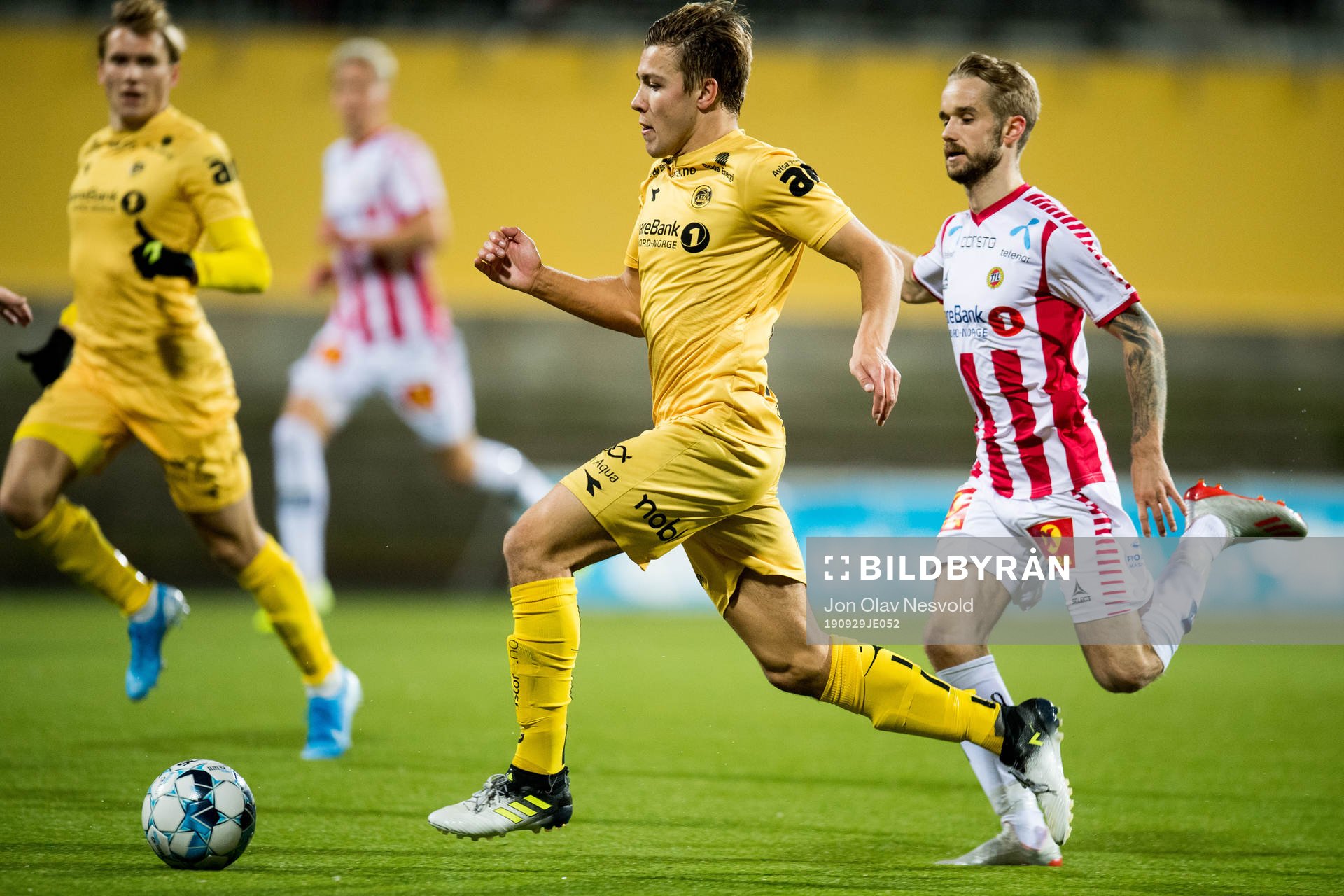 Fredrik André Bjørkan of Bodø/Glimt and Daniel Berntsen of Tromsø during the Eliteserien match between Bodø/Glimt and Tromsø on September 29, 2019 in Bodø.