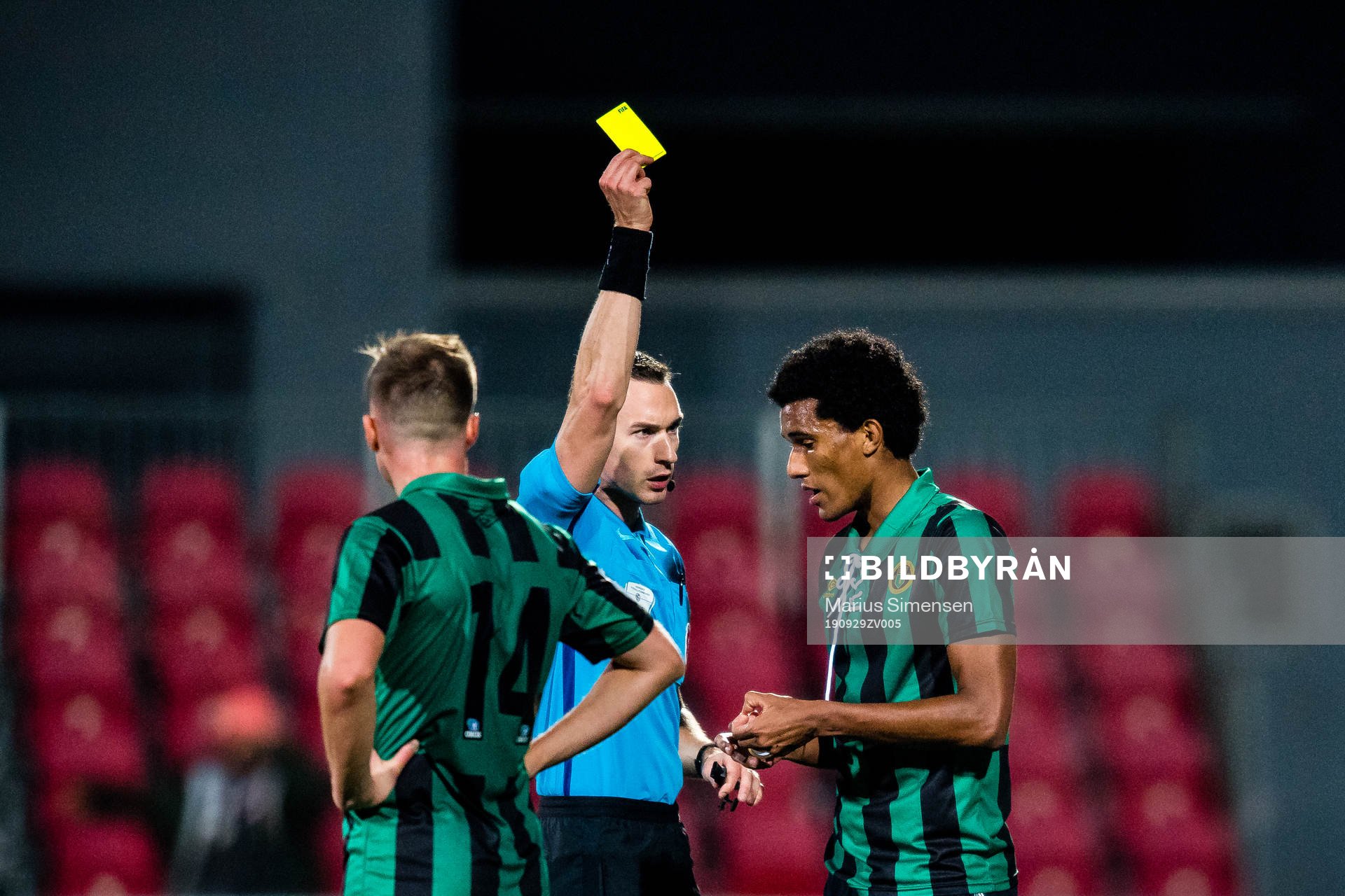 Alfred Richard Scriven of Ull/Kisa gets a yellow card by