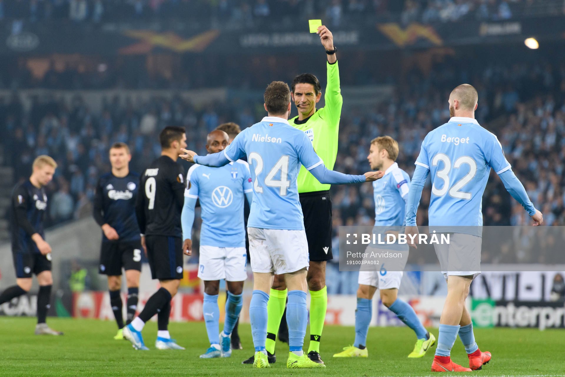 Referee Deniz Aytekin shows a yellow card for Lasse Nielsen of Malmö FF during the Europa league match between Malmö FF and FC Köpenhamn on October 3, 2019 in Malmö.