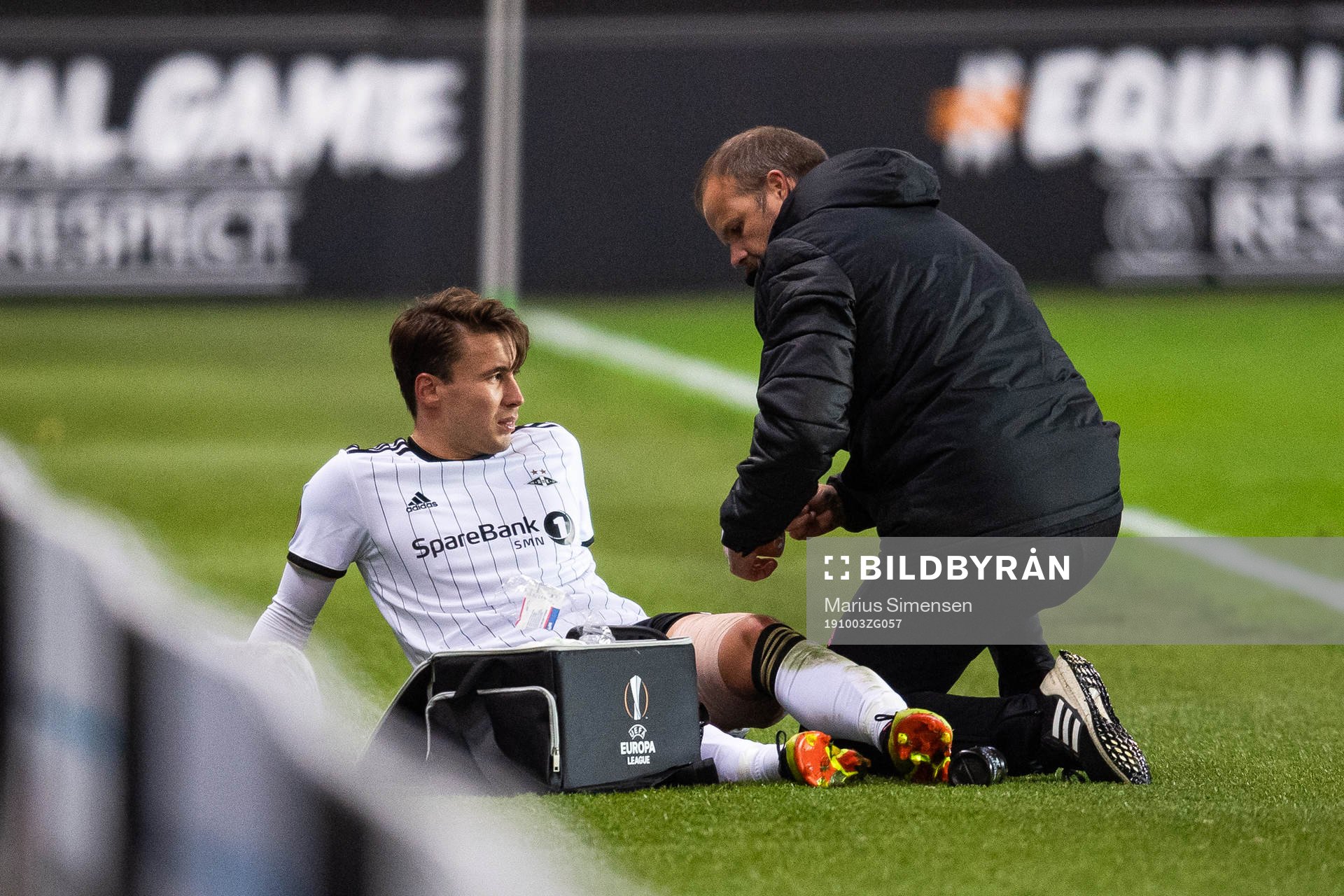 Anders Trondsen of Rosenborg receives medical attention due