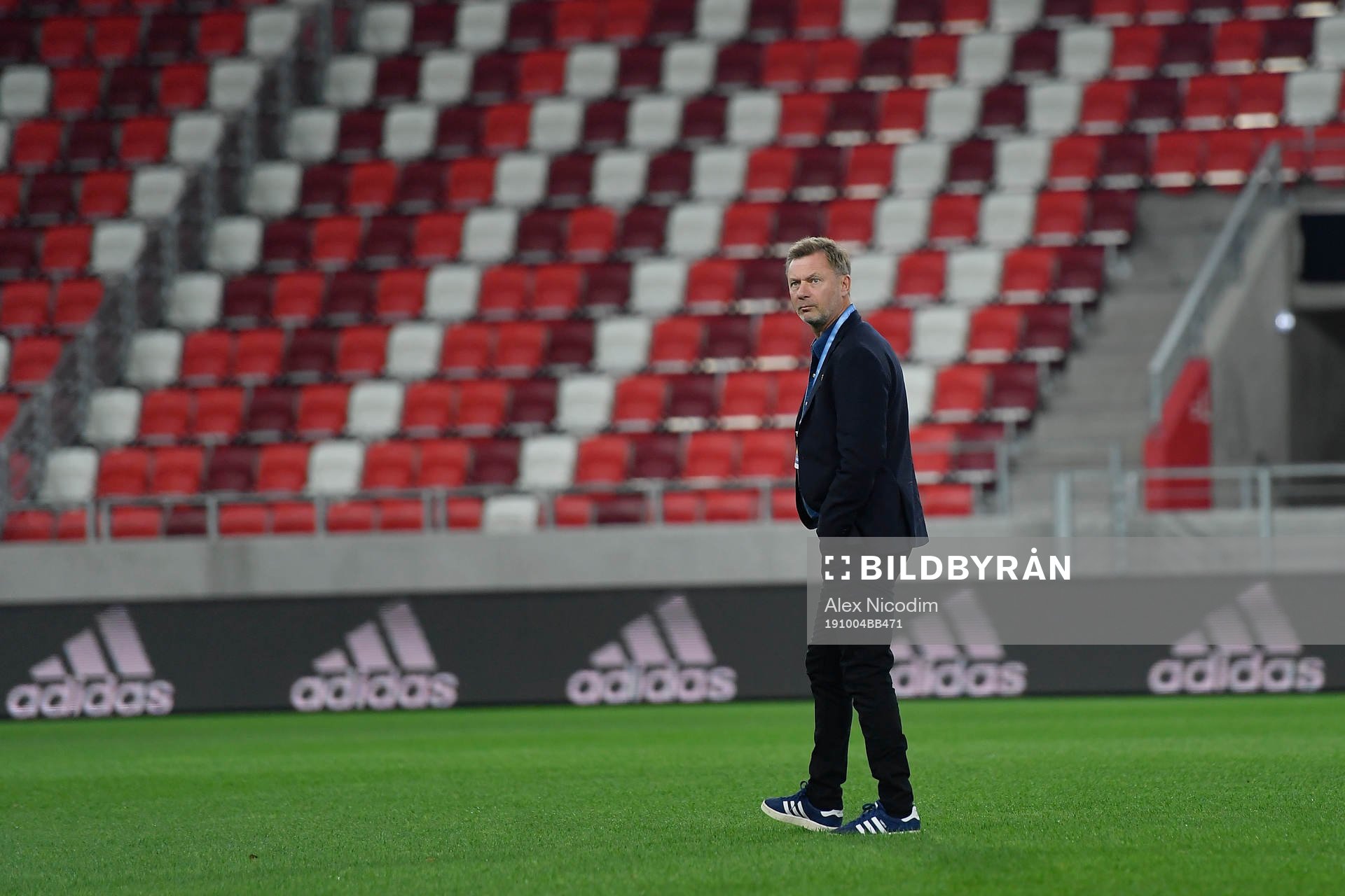 Peter Gerhardsson, head coach of Sweden, inspects the pitch