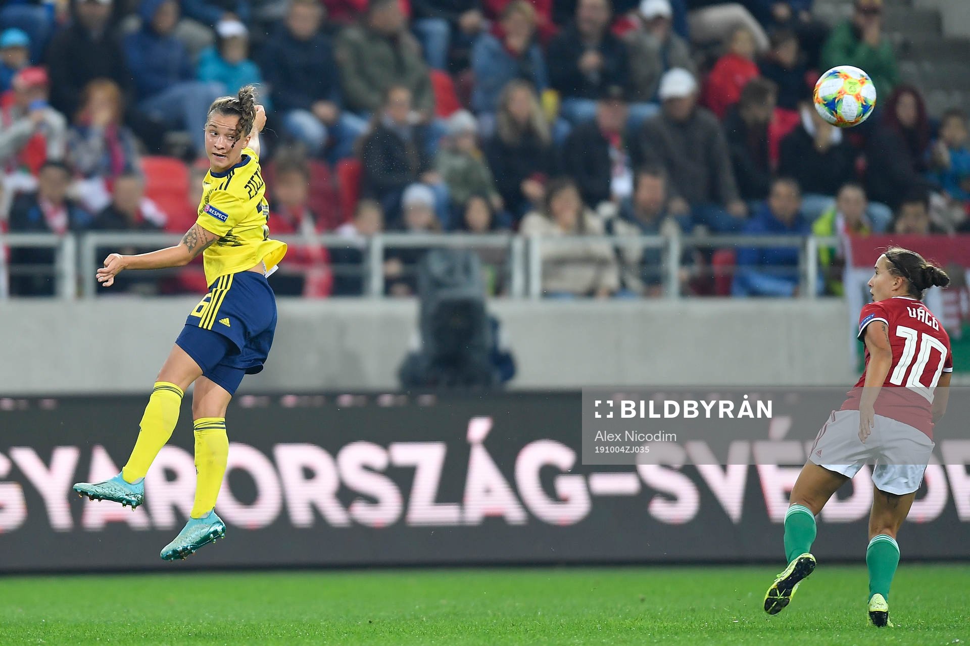 Madelen Ericsson of Sweden vies against Fanni Vago of