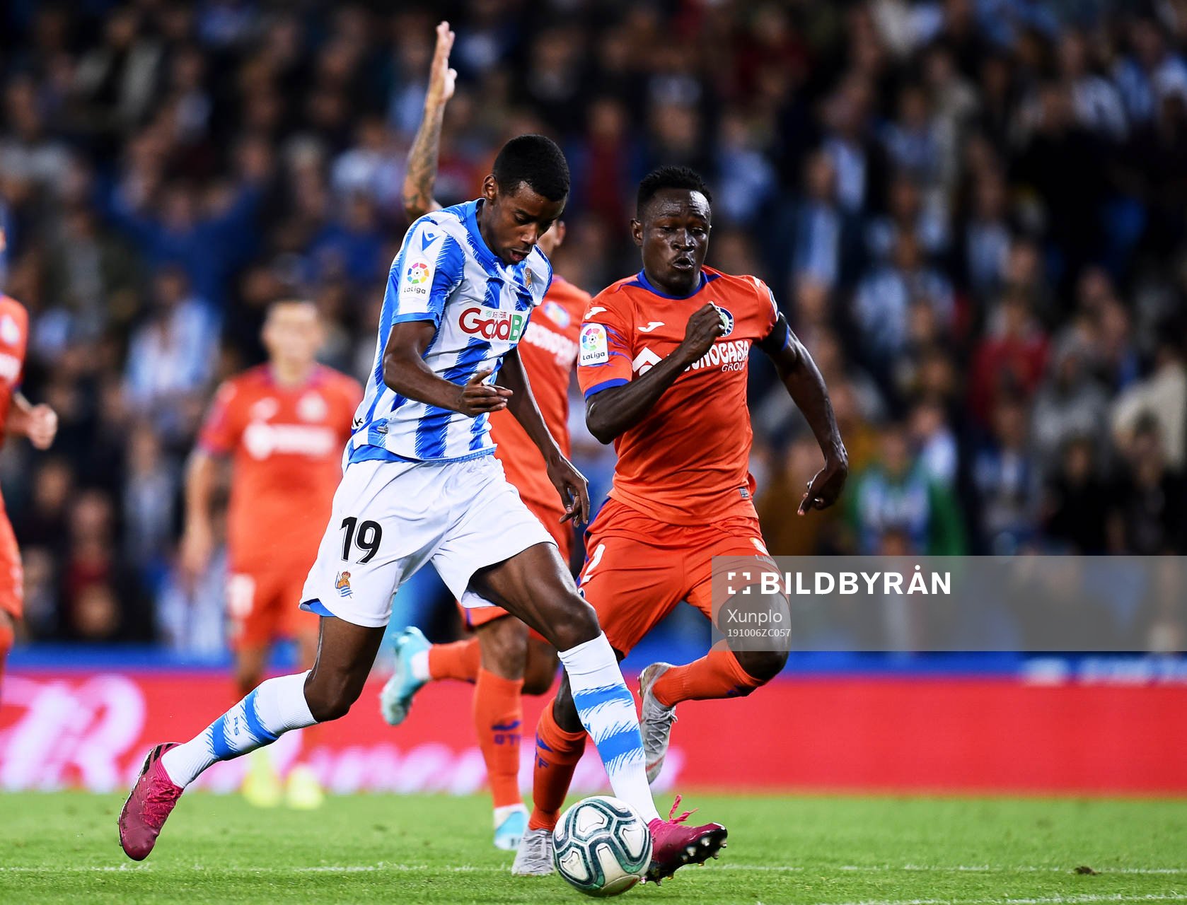 Alexander Isak of Real Sociedad battles for the ball with