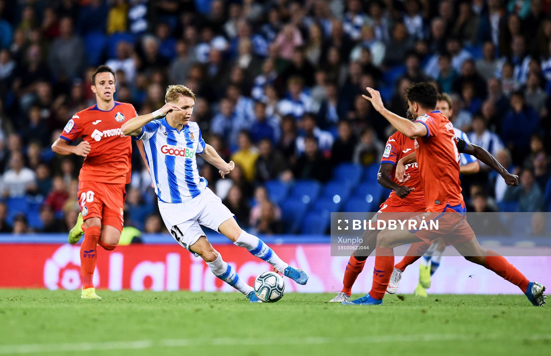 Martin Odegaard of Real Sociedad battles for the ball with
