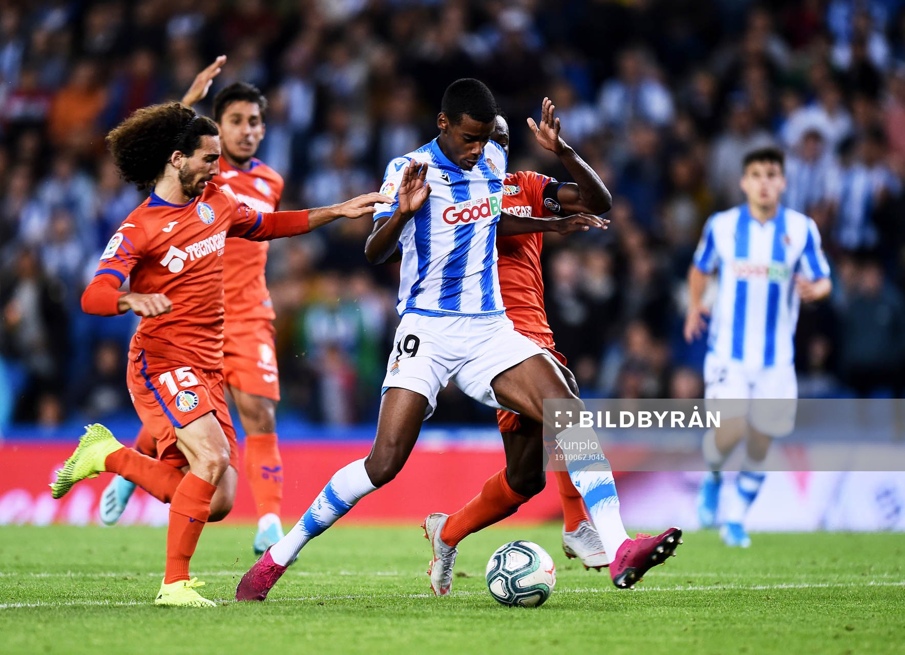 Alexander Isak of Real Sociedad battles for the ball with