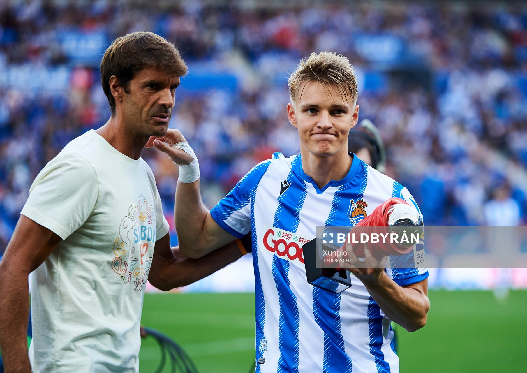 Xavi Prieto gives Martin Odegaard of Real Sociedad the