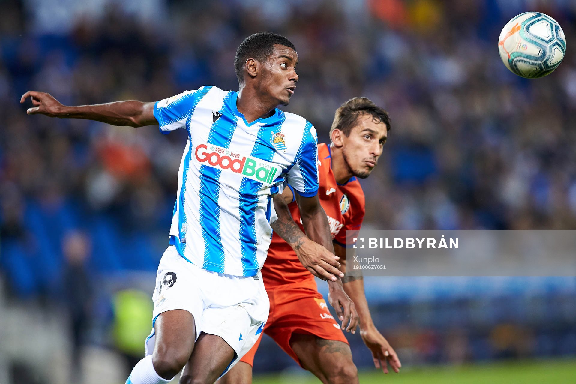 Alexander Isak of Real Sociedad dispute the ball with