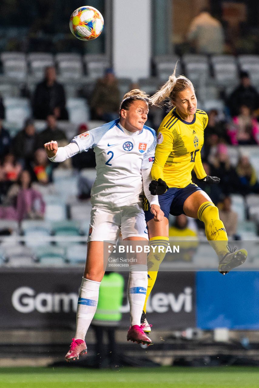 Lucie Harsanyova of Slovakia defends against Nathalie