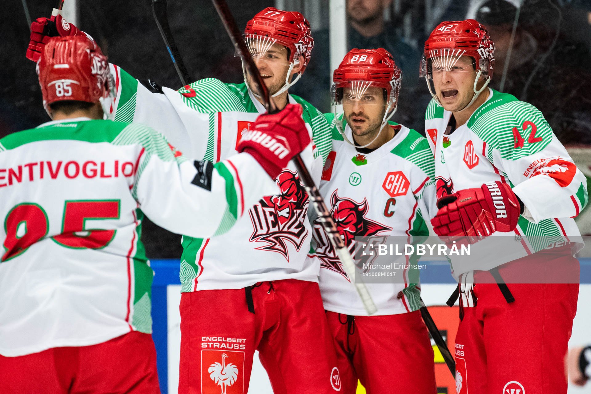 Joey Martin of Cardiff (M) celebrate with team mates