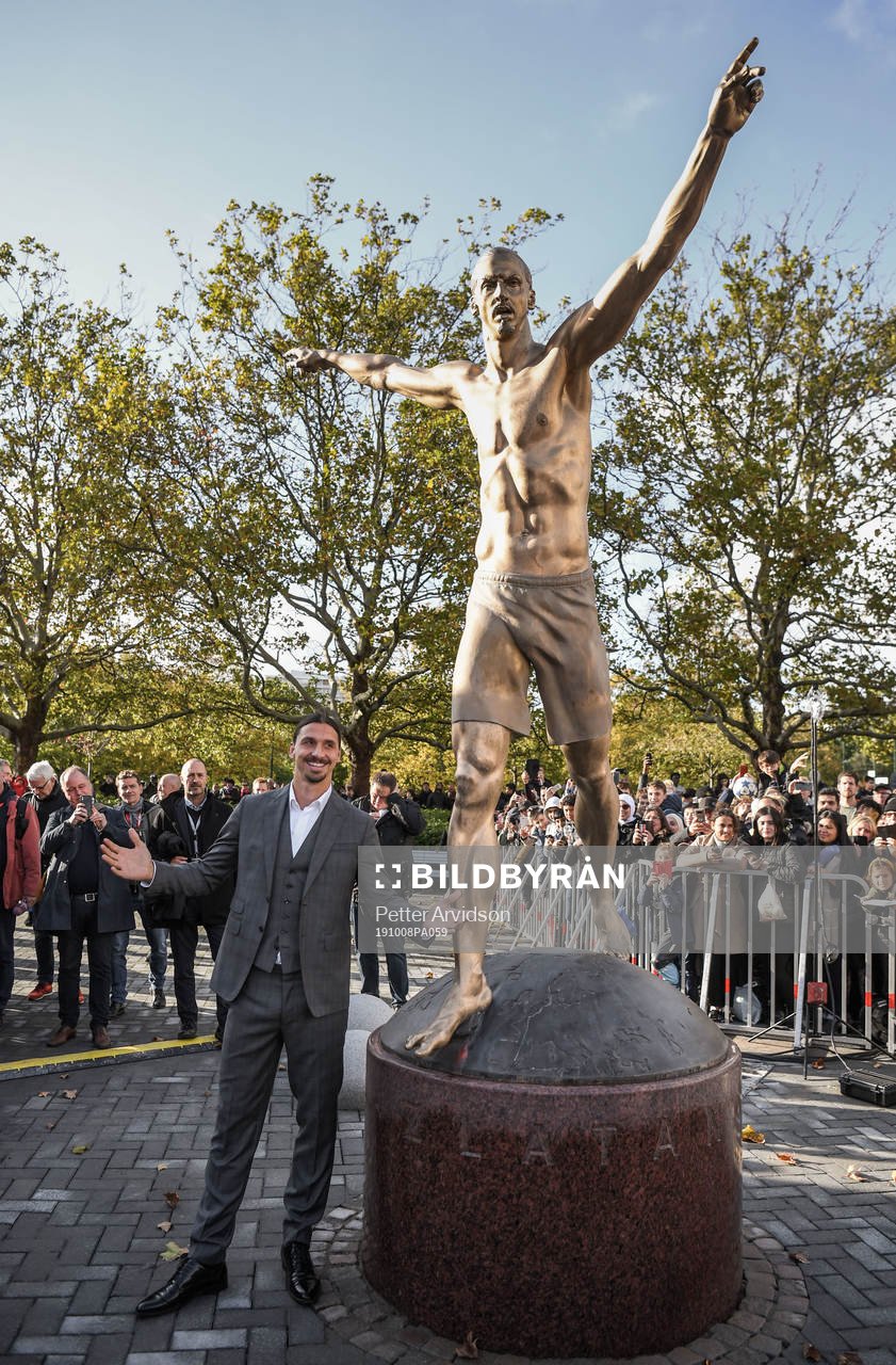Zlatan Ibrahimovic pose with his statue at the revealing