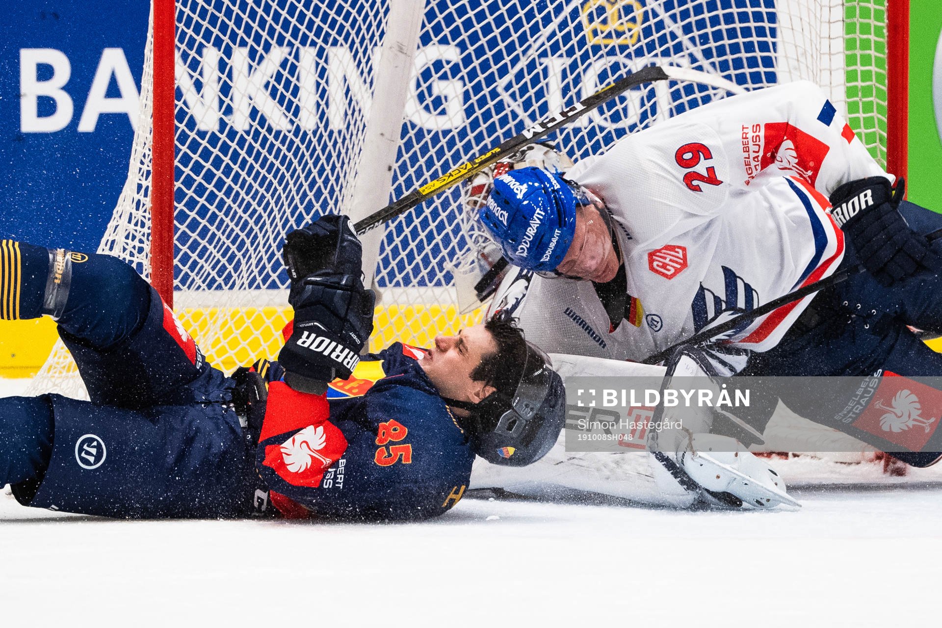 Michael Haga of Djurgården collide with Denis Reul of