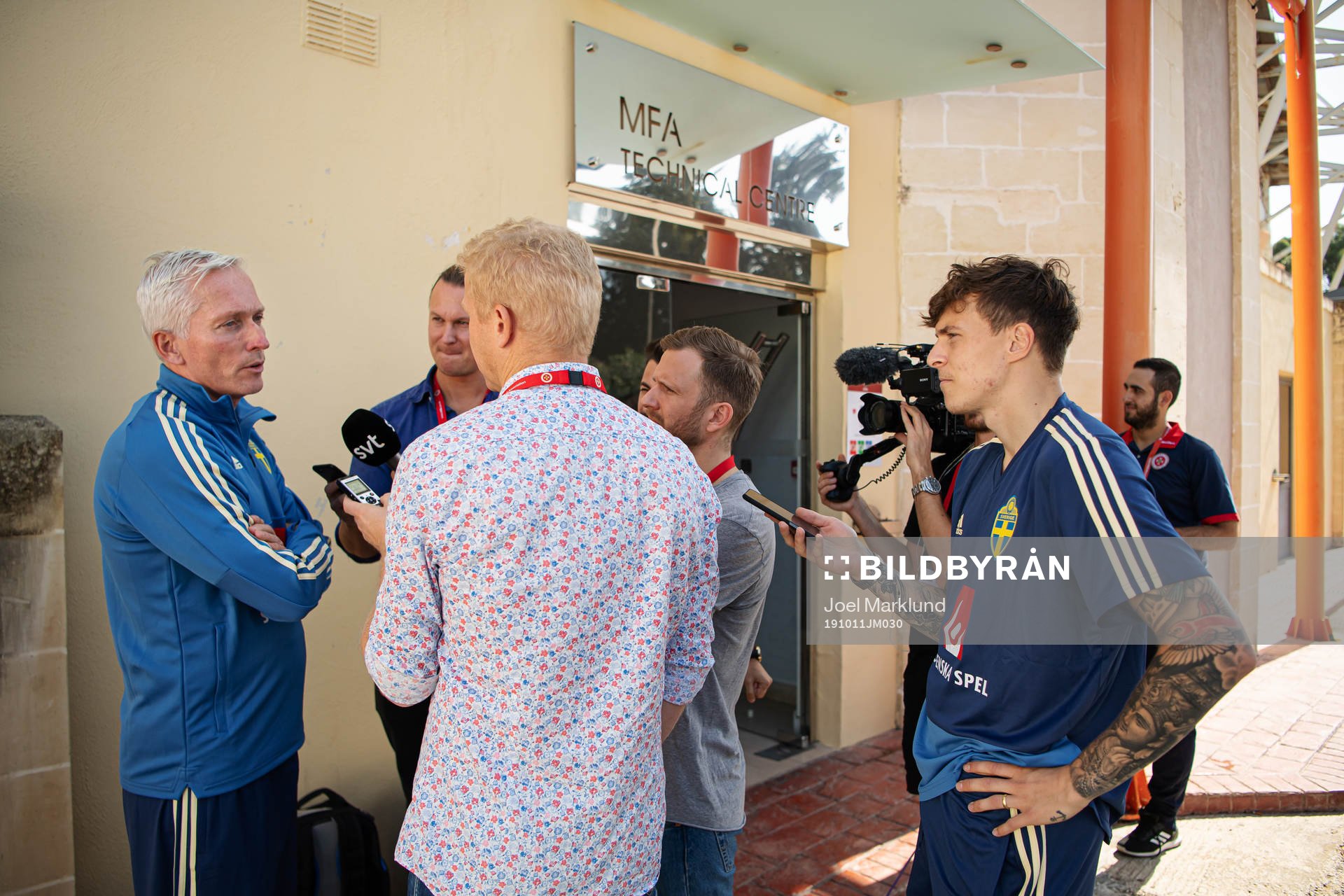 Player Victor Nilsson Lindelöf stands next to reporters