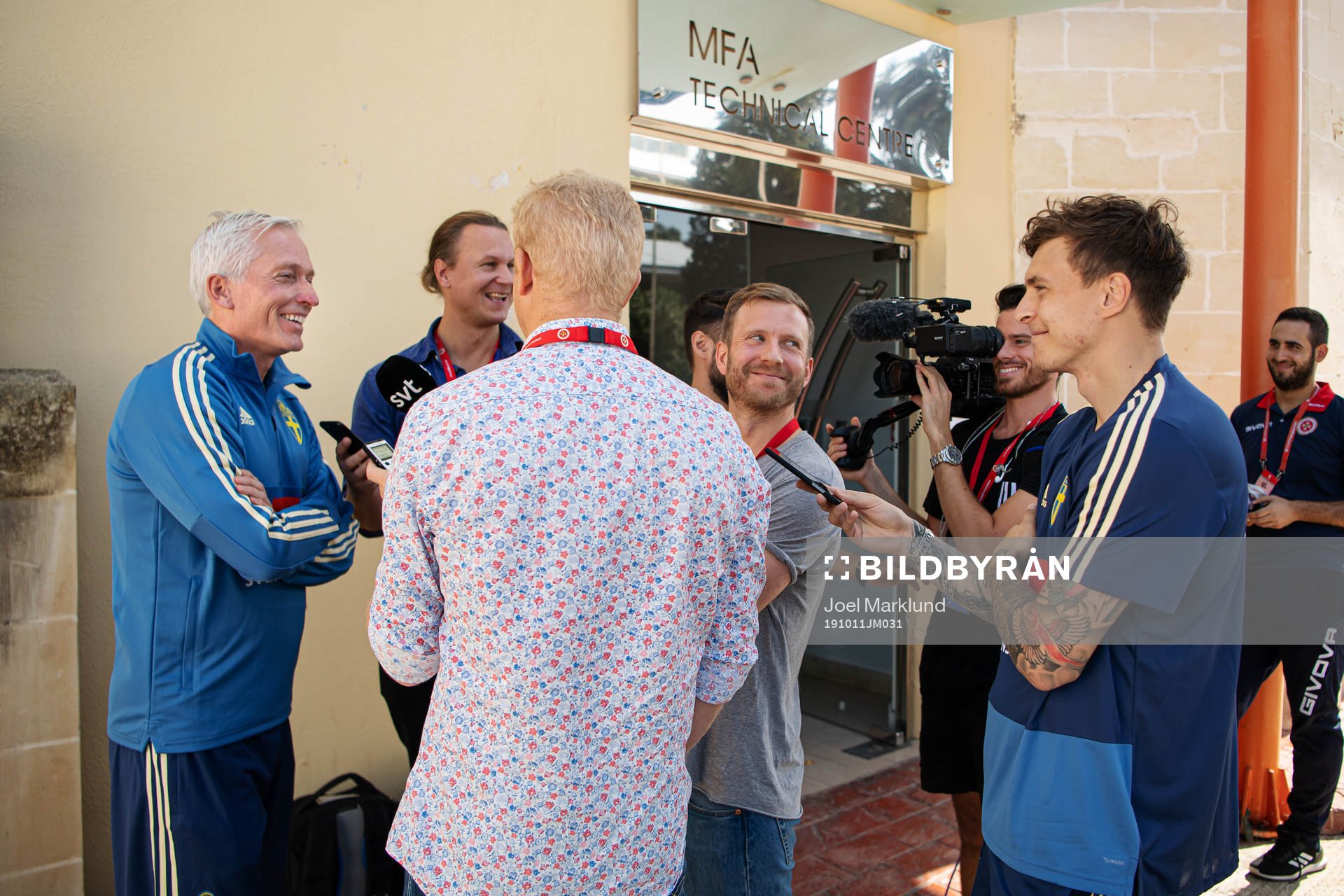 Player Victor Nilsson Lindelöf stands next to reporters