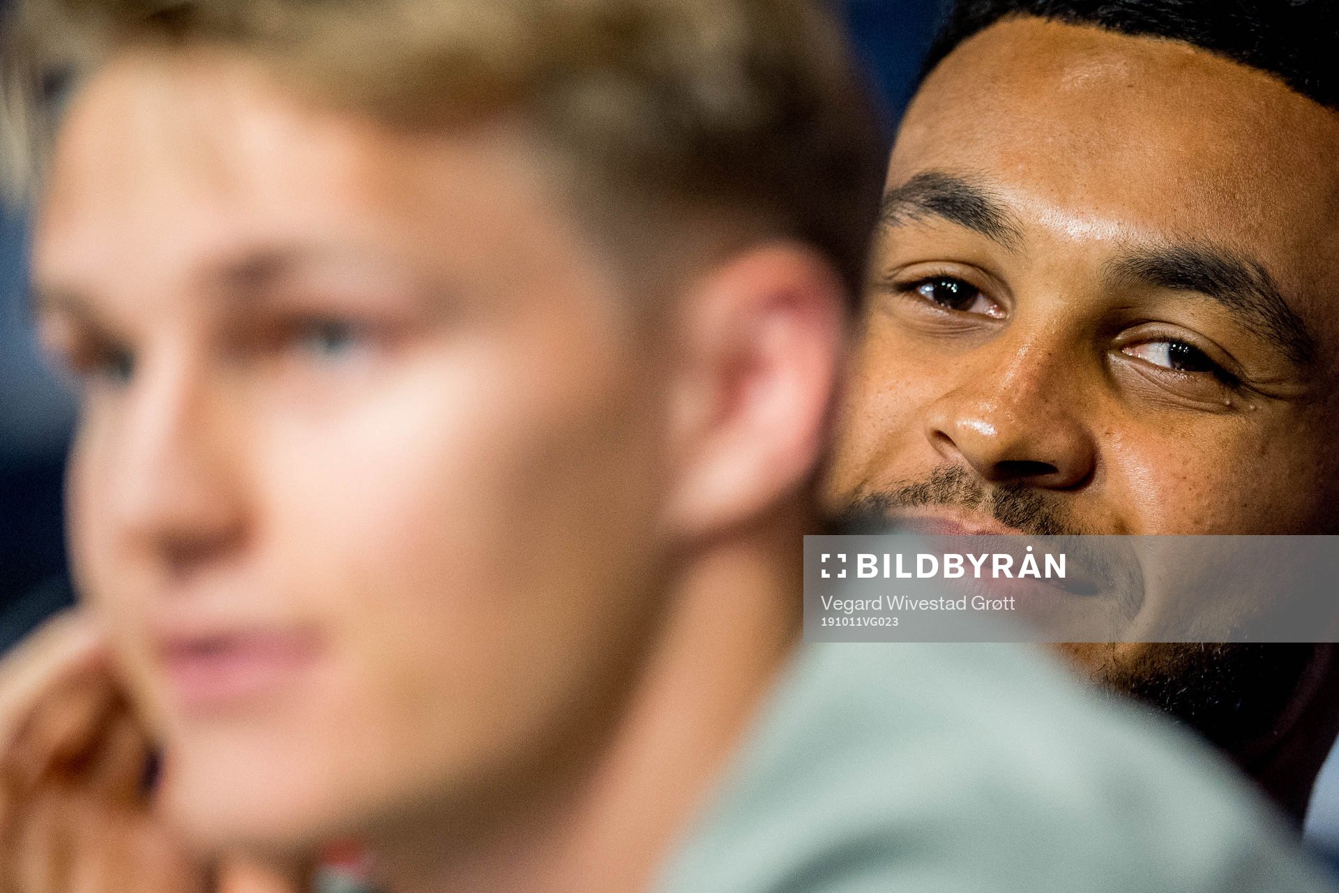 Joshua King of Norway listens to Martin Ødegaard