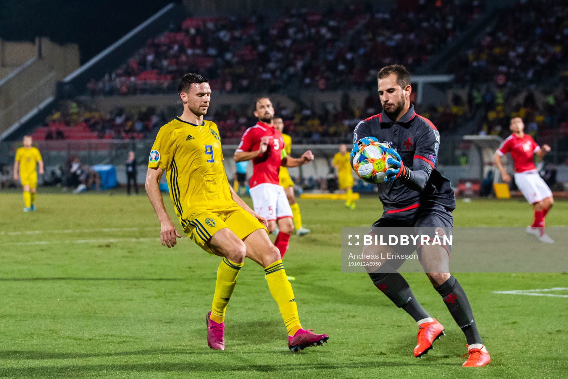Marcus Berg of Sweden and goalkeeper Henry Bonello