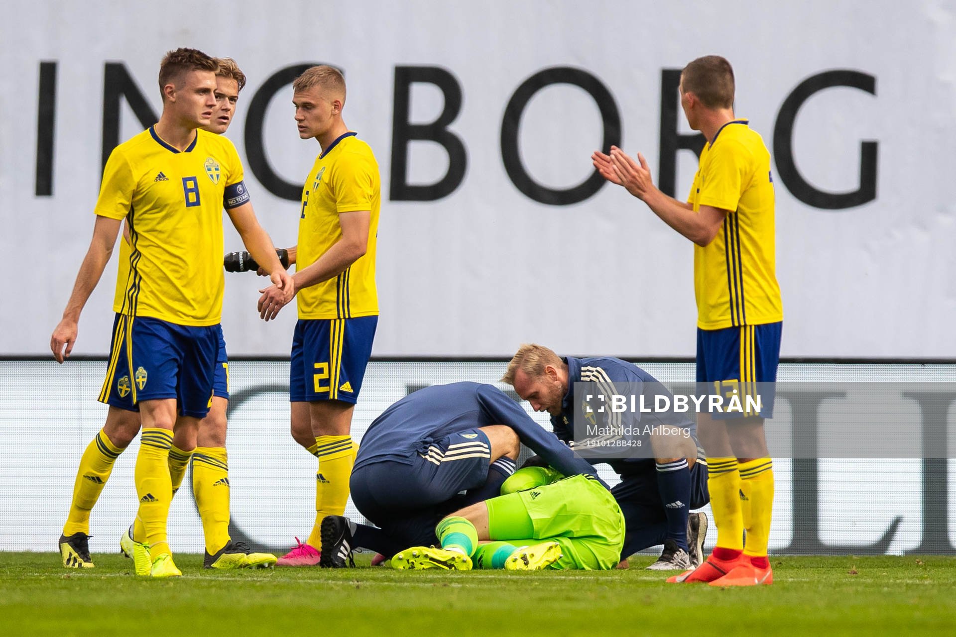 Goalkeeper Pontus Dahlberg of Sweden receives medical