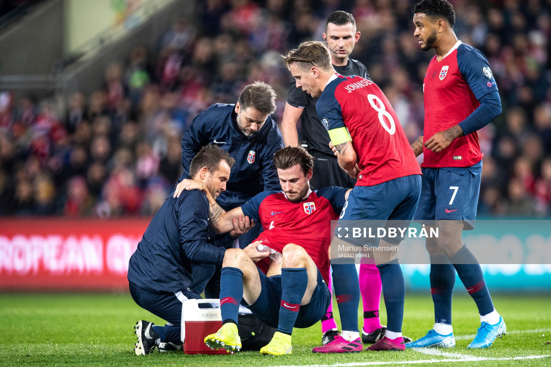 Håvard Nordtveit of Norway with medical attention because