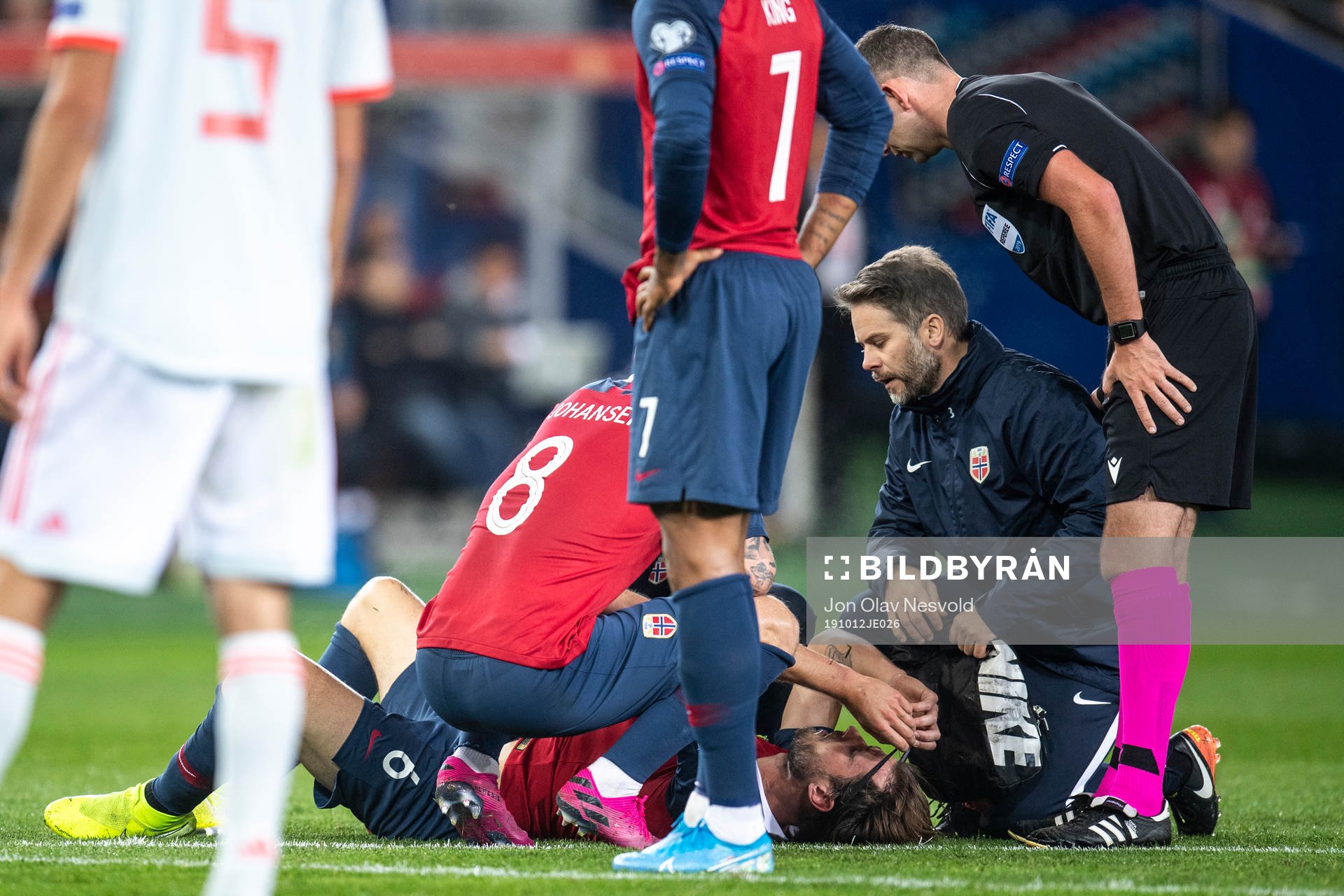 Håvard Nordtveit of Norway recieves medical attention