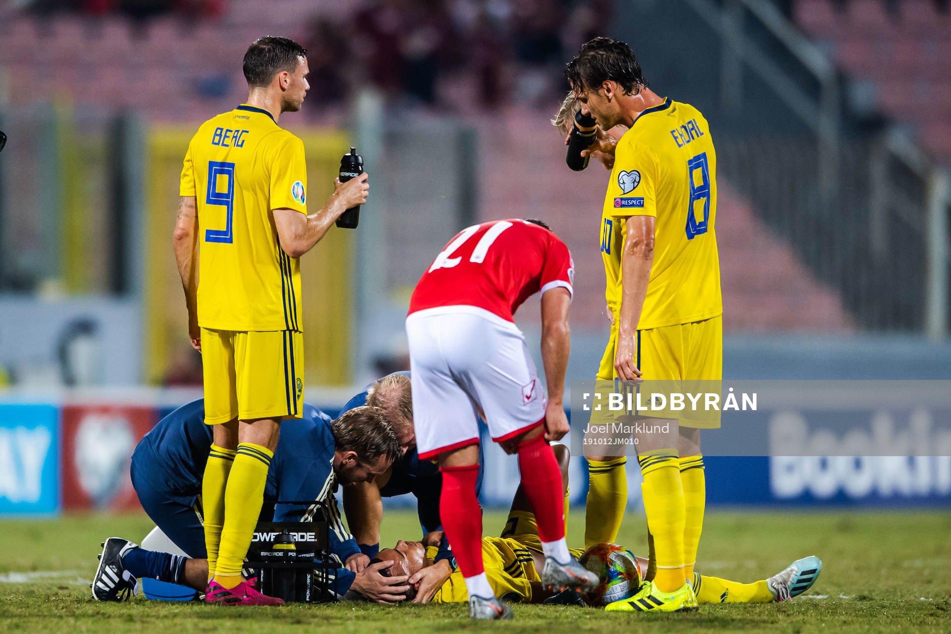 Robin Quaison of Sweden receives medical treatment