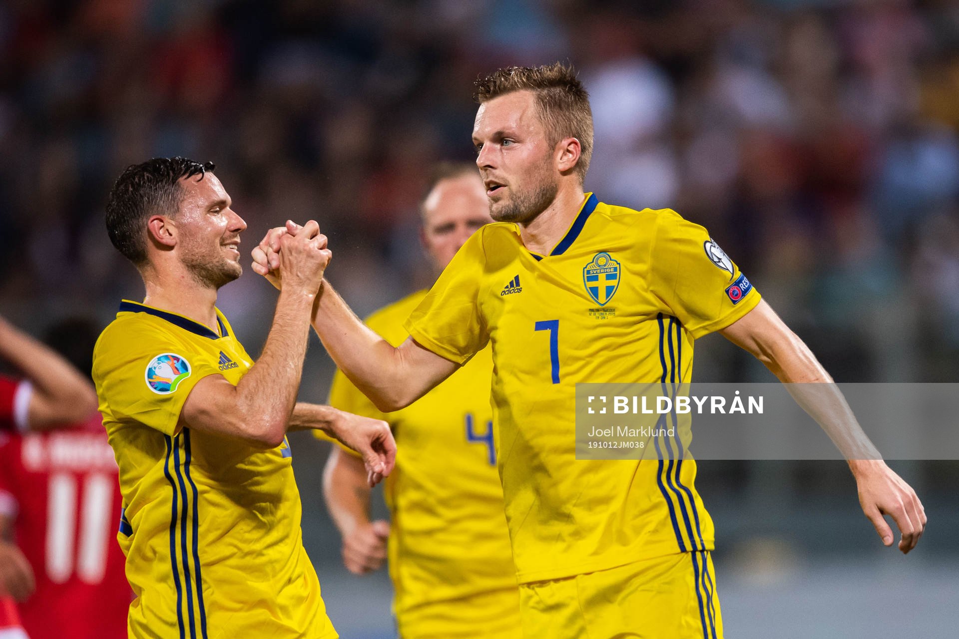 Marcus Berg and Sebastian Larsson of Sweden celebrate