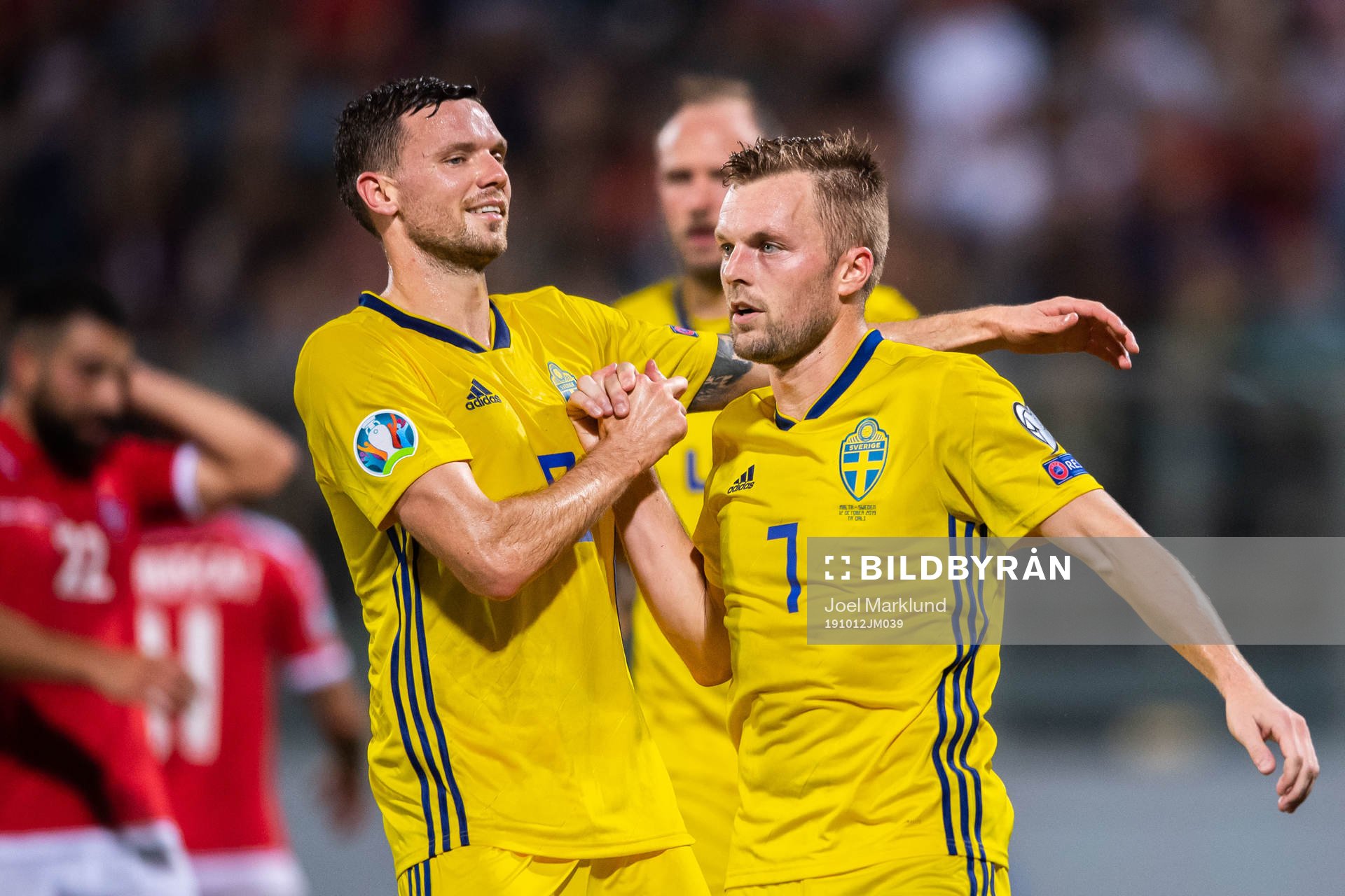 Marcus Berg and Sebastian Larsson of Sweden celebrate