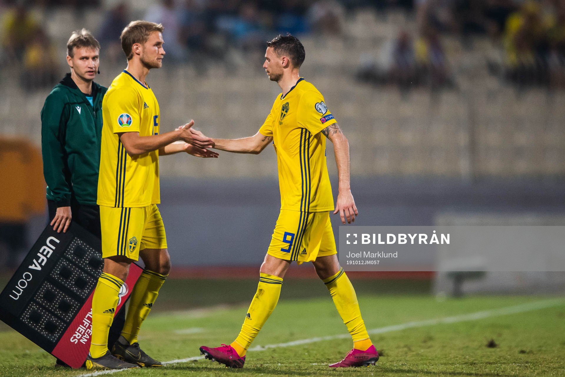 Marcus Berg changes with Sebastian Andersson of Sweden