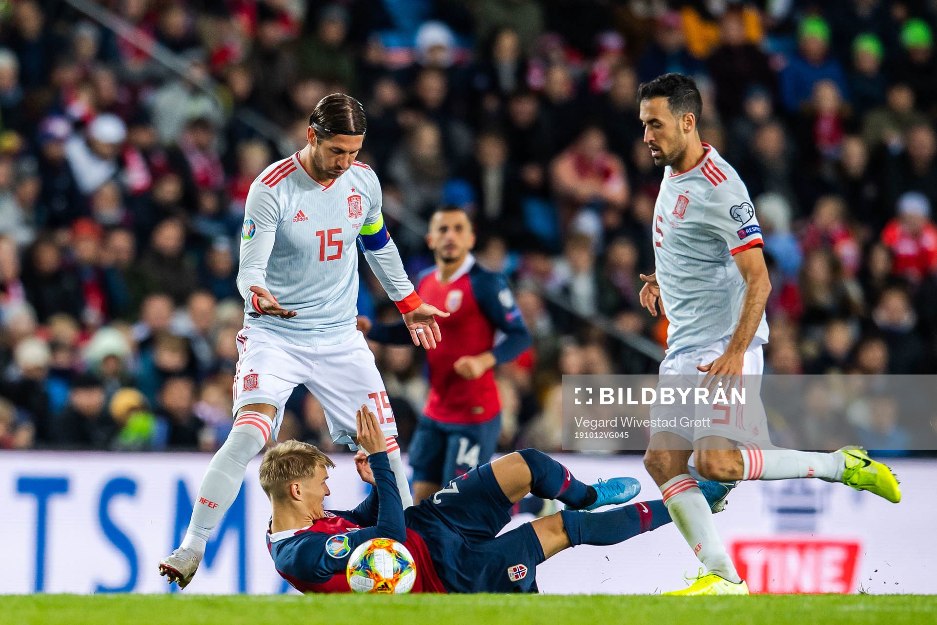 Sergio Ramos and Sergio Busquets of Spain against Martin Ødegaard of Norway during the UEFA Euro Qualifier football match between Norway and Spain on October 12, 2019 in Oslo.