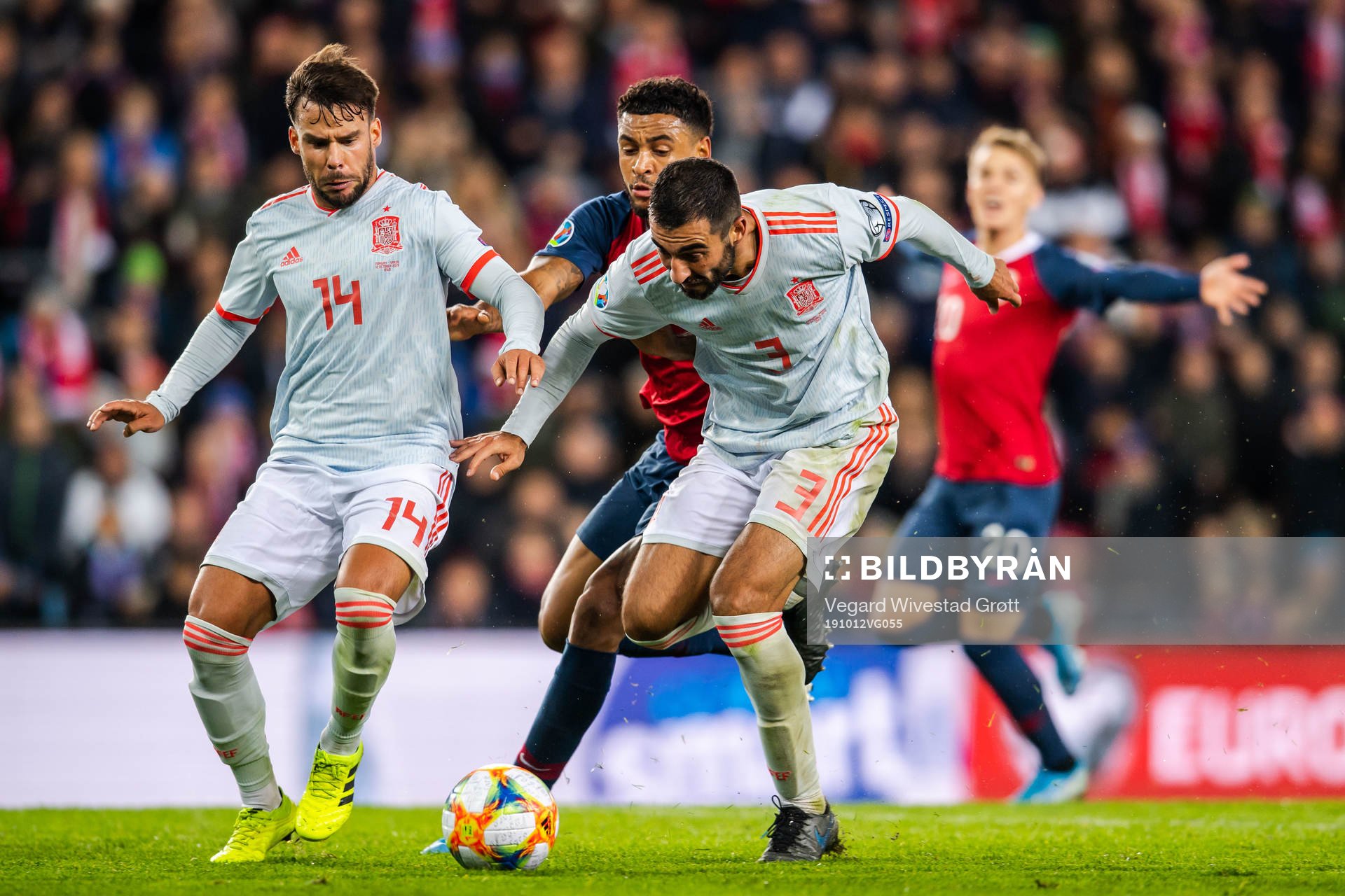 Juan Bernat and Raul Albiol of Spain against Joshua King of