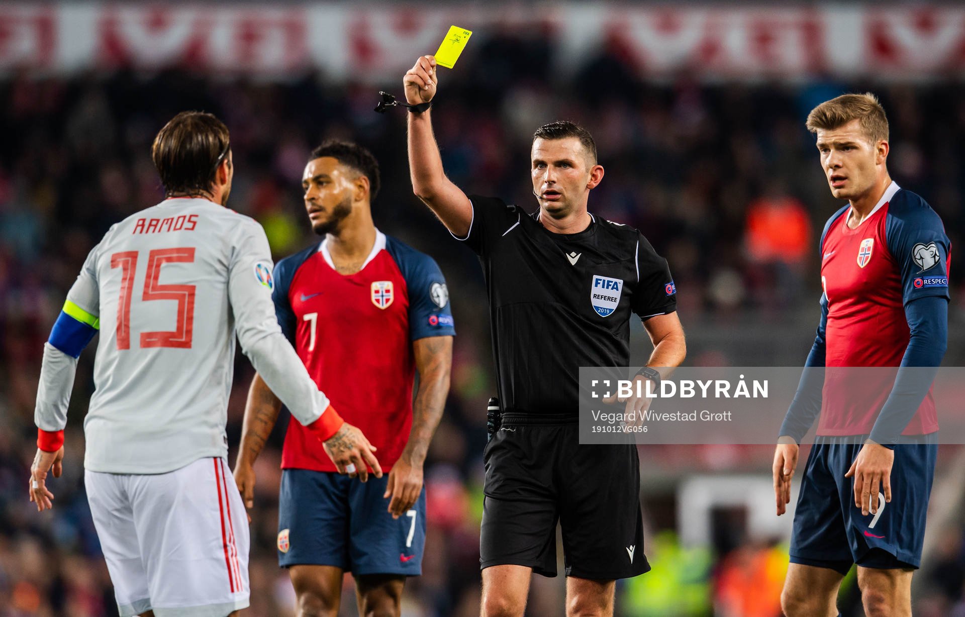 Sergio Ramos of Spain is shown a warning by referee Michael