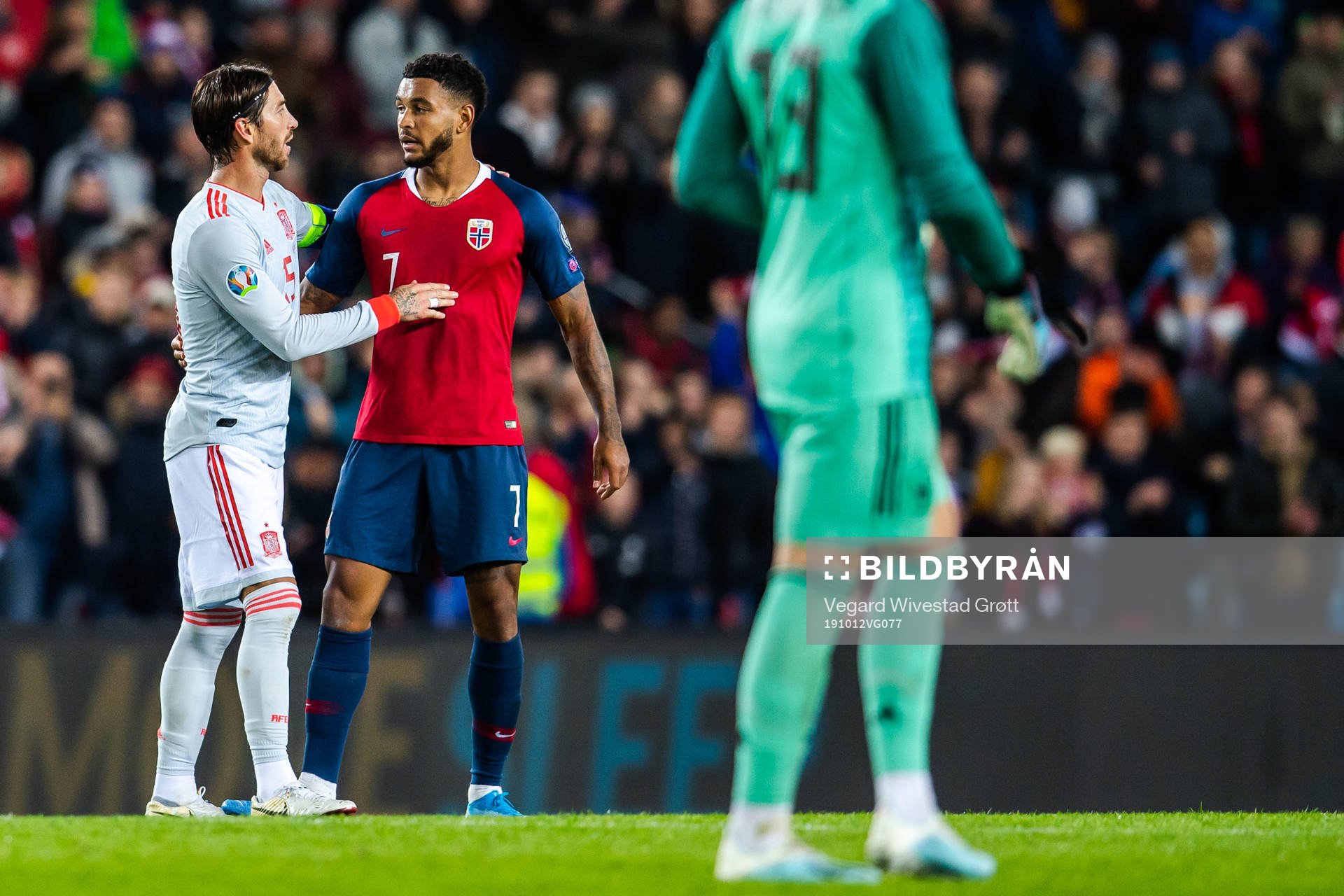 Sergio Ramos of Spain and Joshua King of Norway