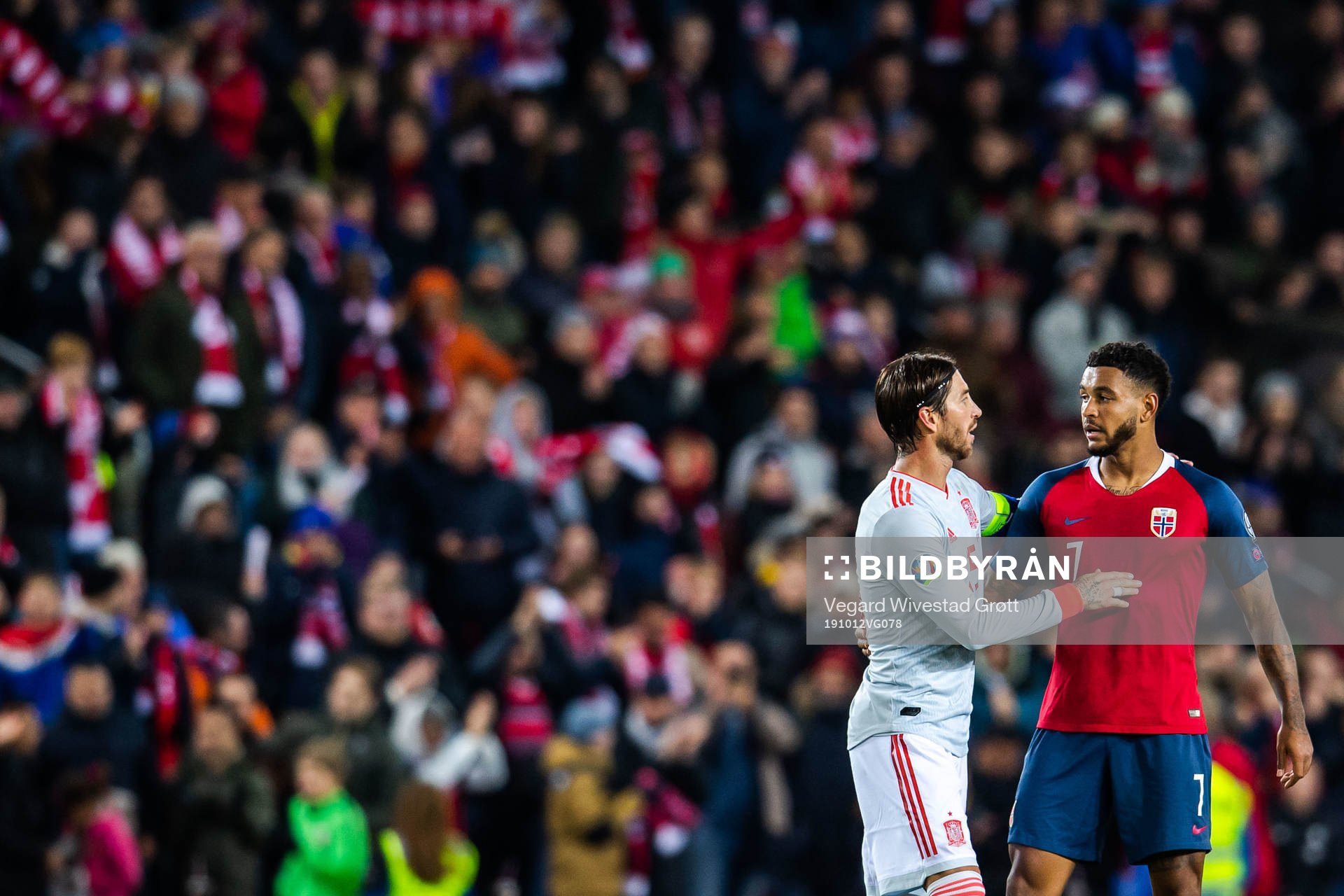 Sergio Ramos of Spain and Joshua King of Norway
