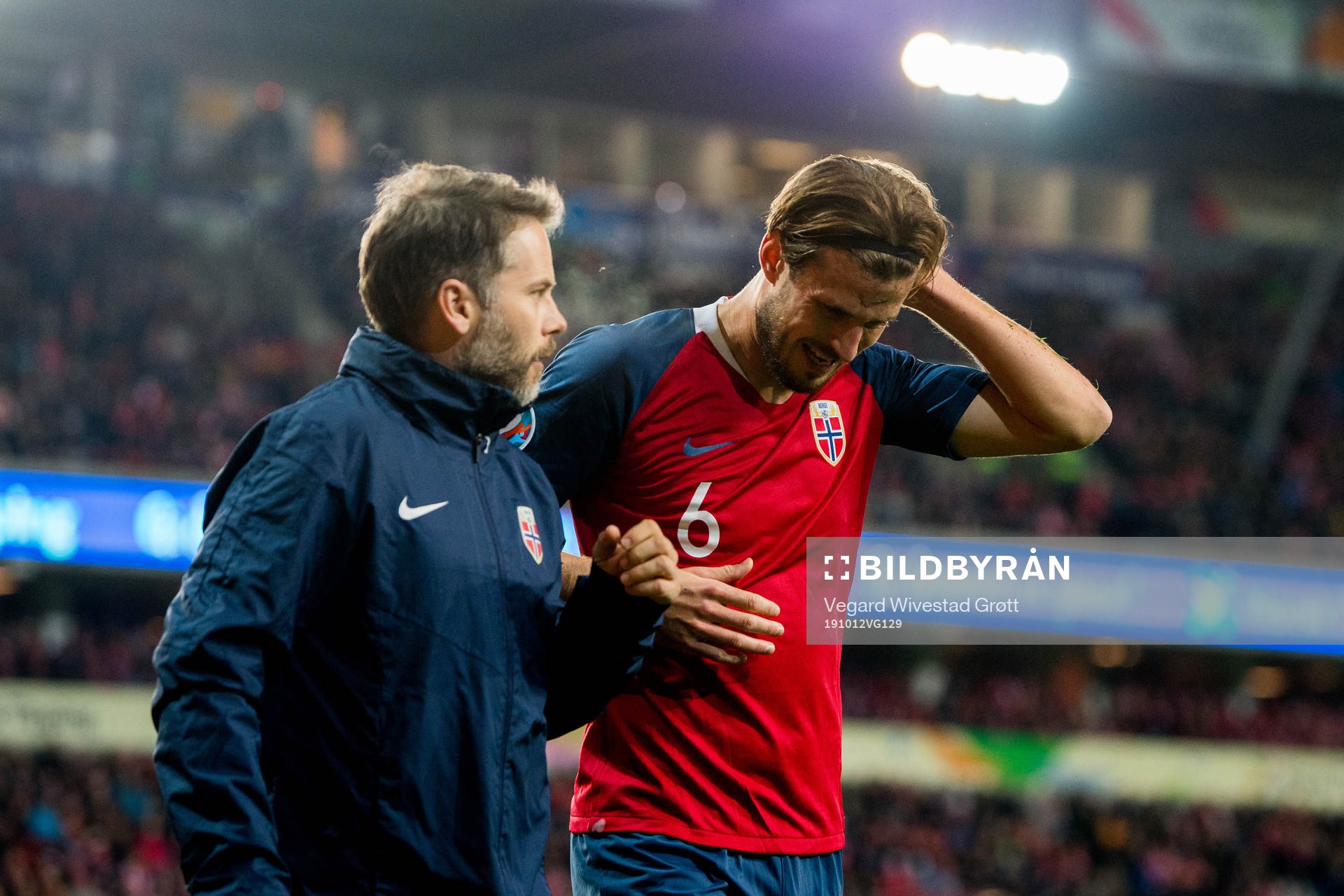 Håvard Nordtveit of Norway receives medical treatment from