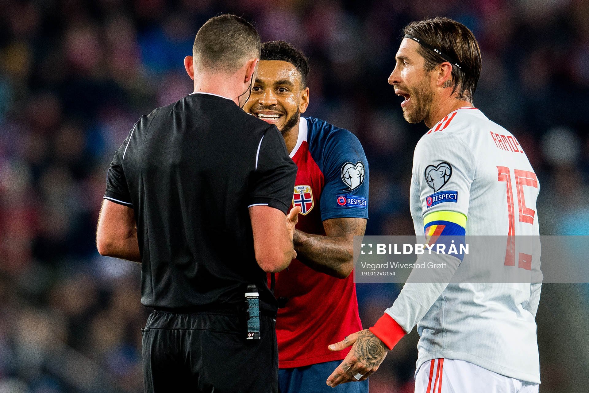 Joshua King of Norway and Sergio Ramos of Spain argue with