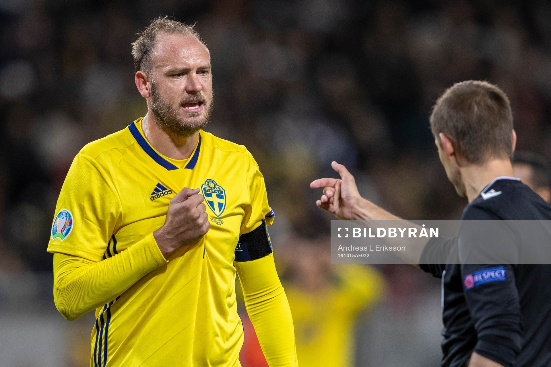 Andreas Granqvist of Sweden and referee Clement Turpin