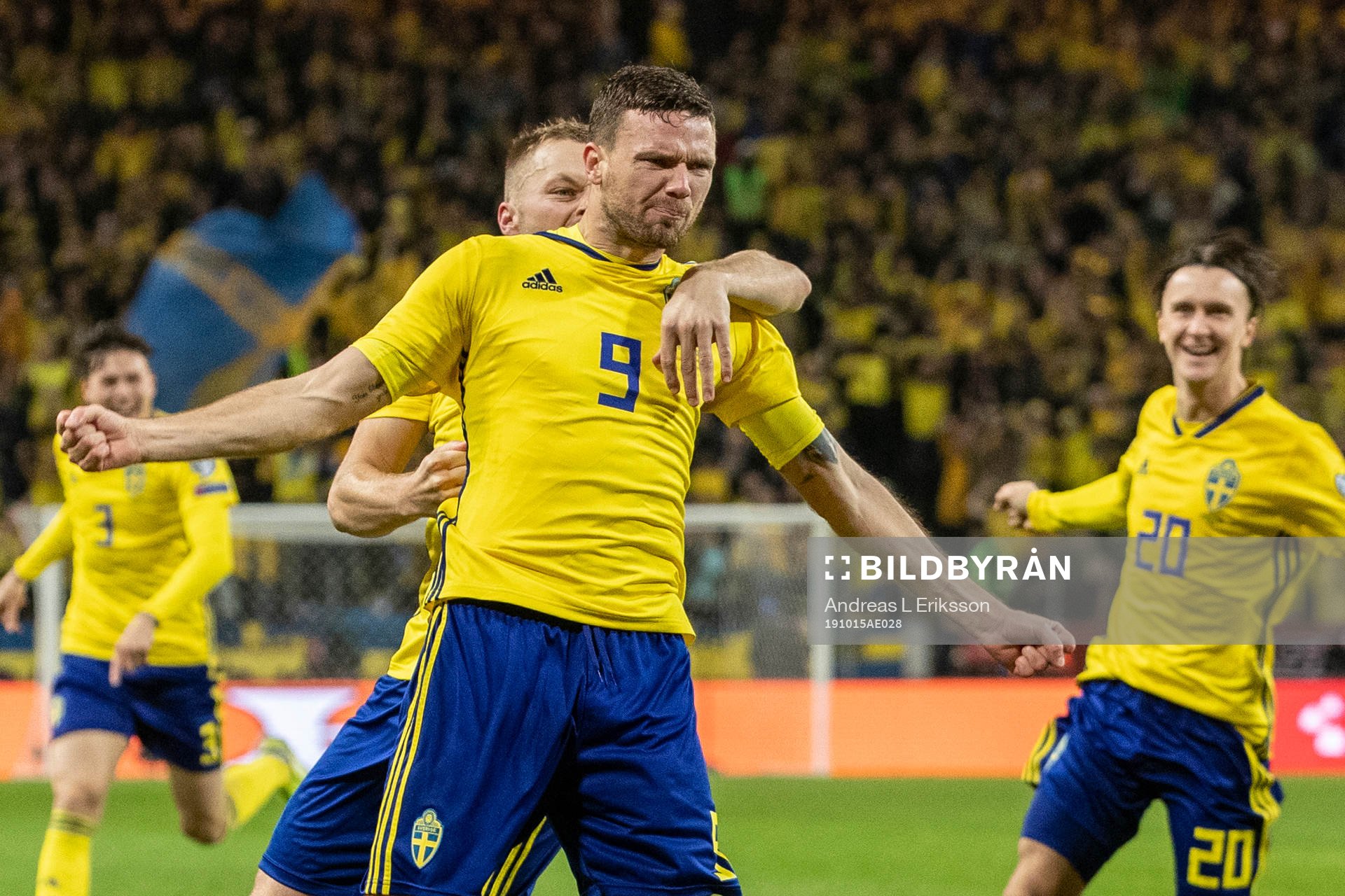 Marcus Berg of Sweden celebrates with Sebastian Larsson and