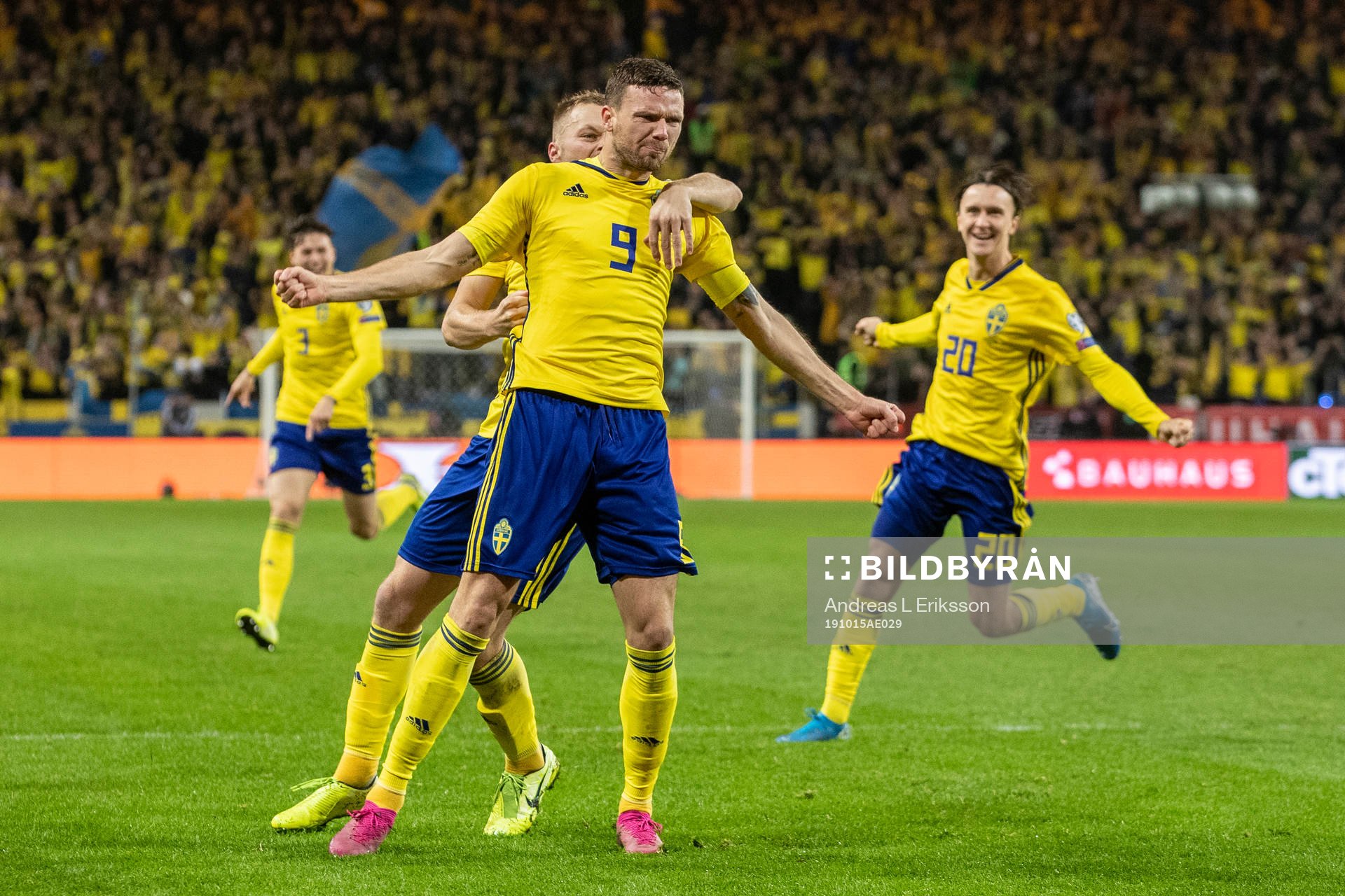 Marcus Berg of Sweden celebrates with Sebastian Larsson and