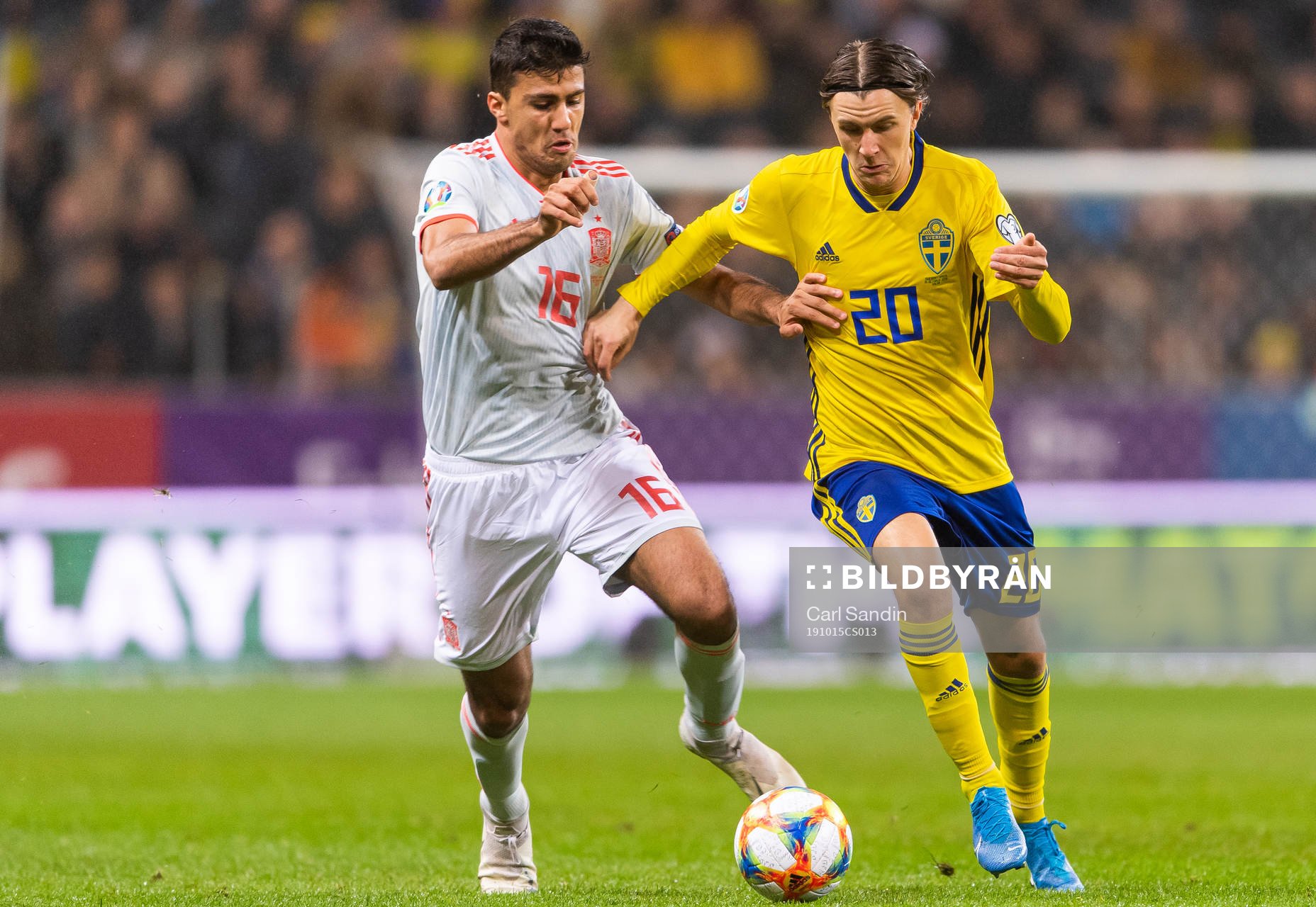 Rodri of Spain and Kristoffer Olsson of Sweden compete for