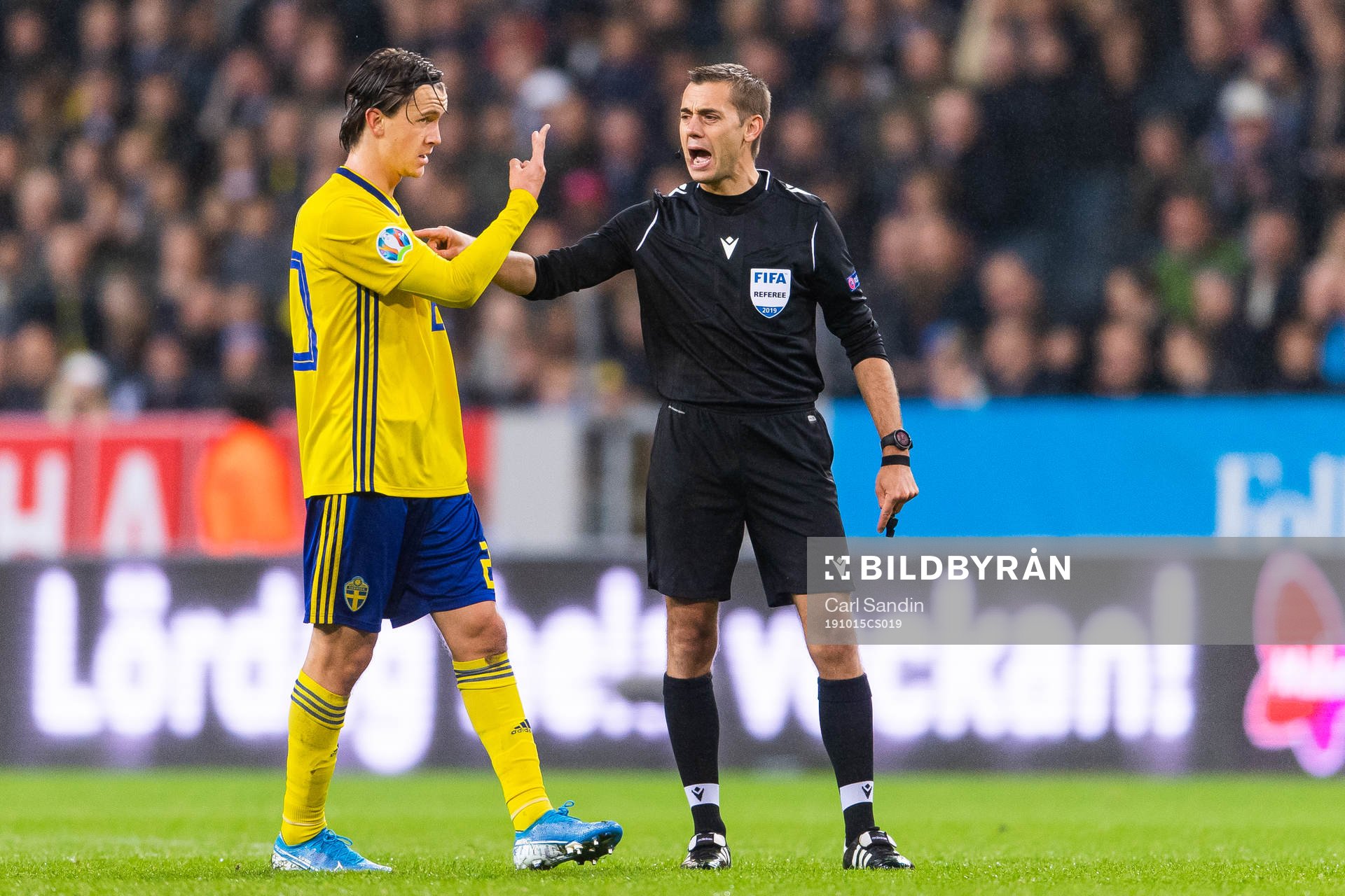 Kristoffer Olsson of Sweden in a discussion with referee