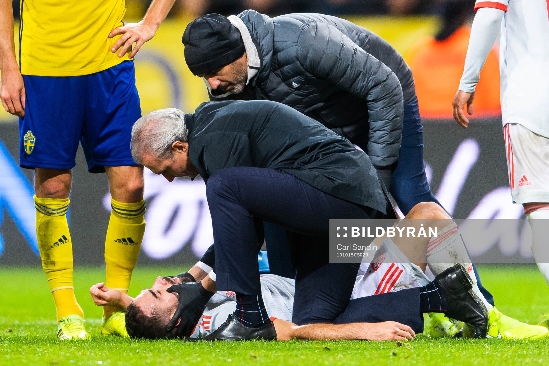Dani Carvajal of Spain lies downand gets medical attention