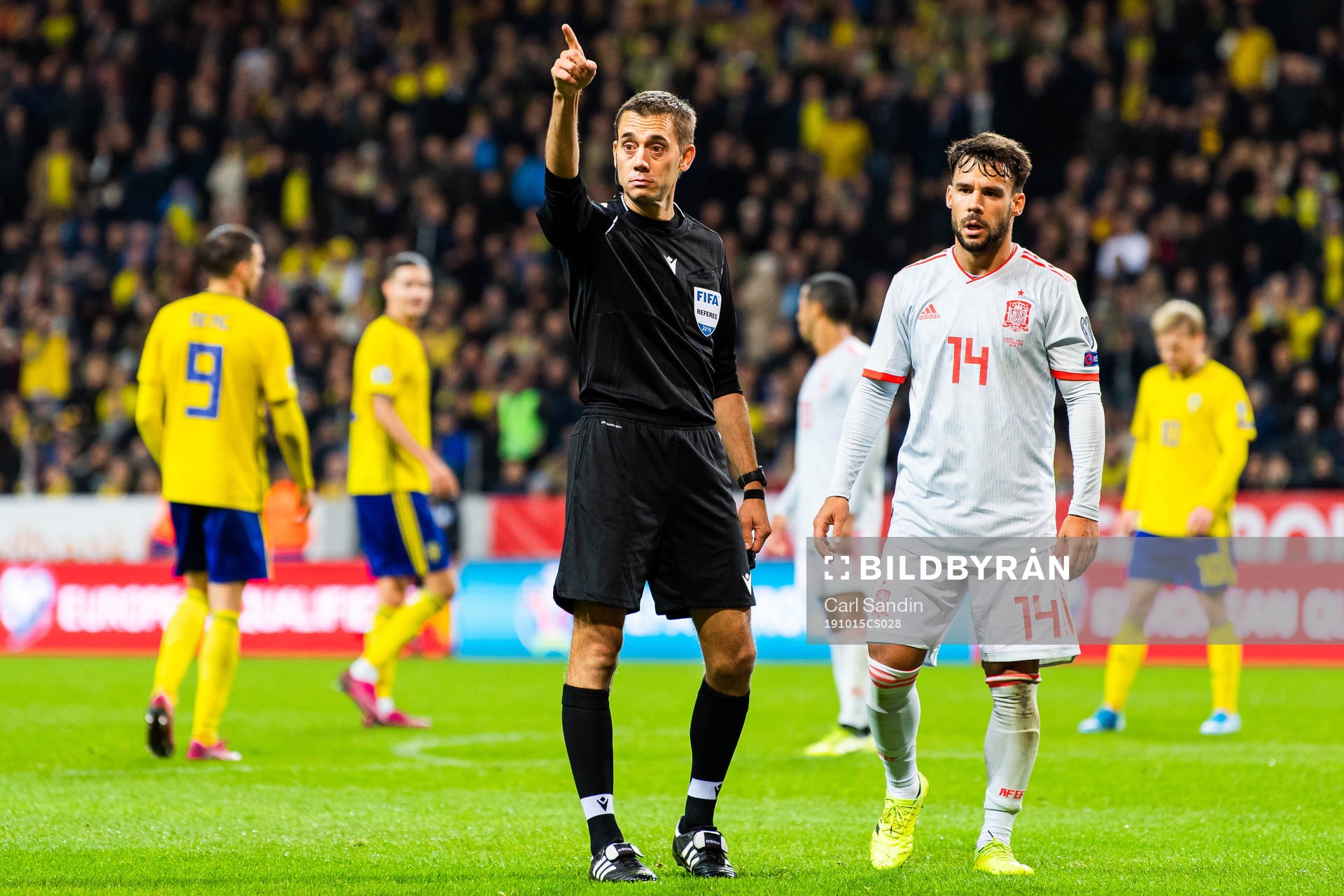 Referee Clement Turpin calls a corner kick