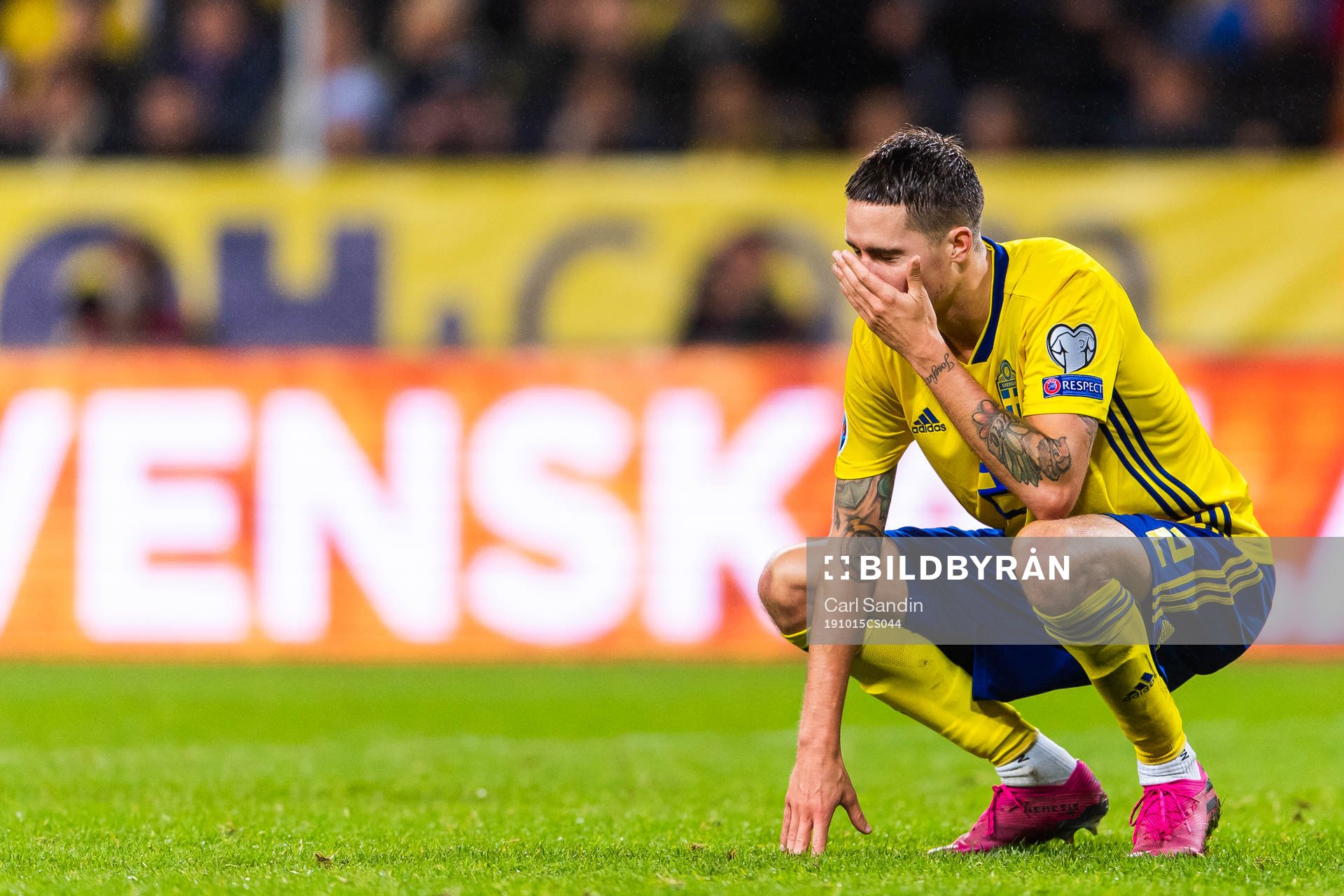 Mikael Lustig of Sweden looks dejected